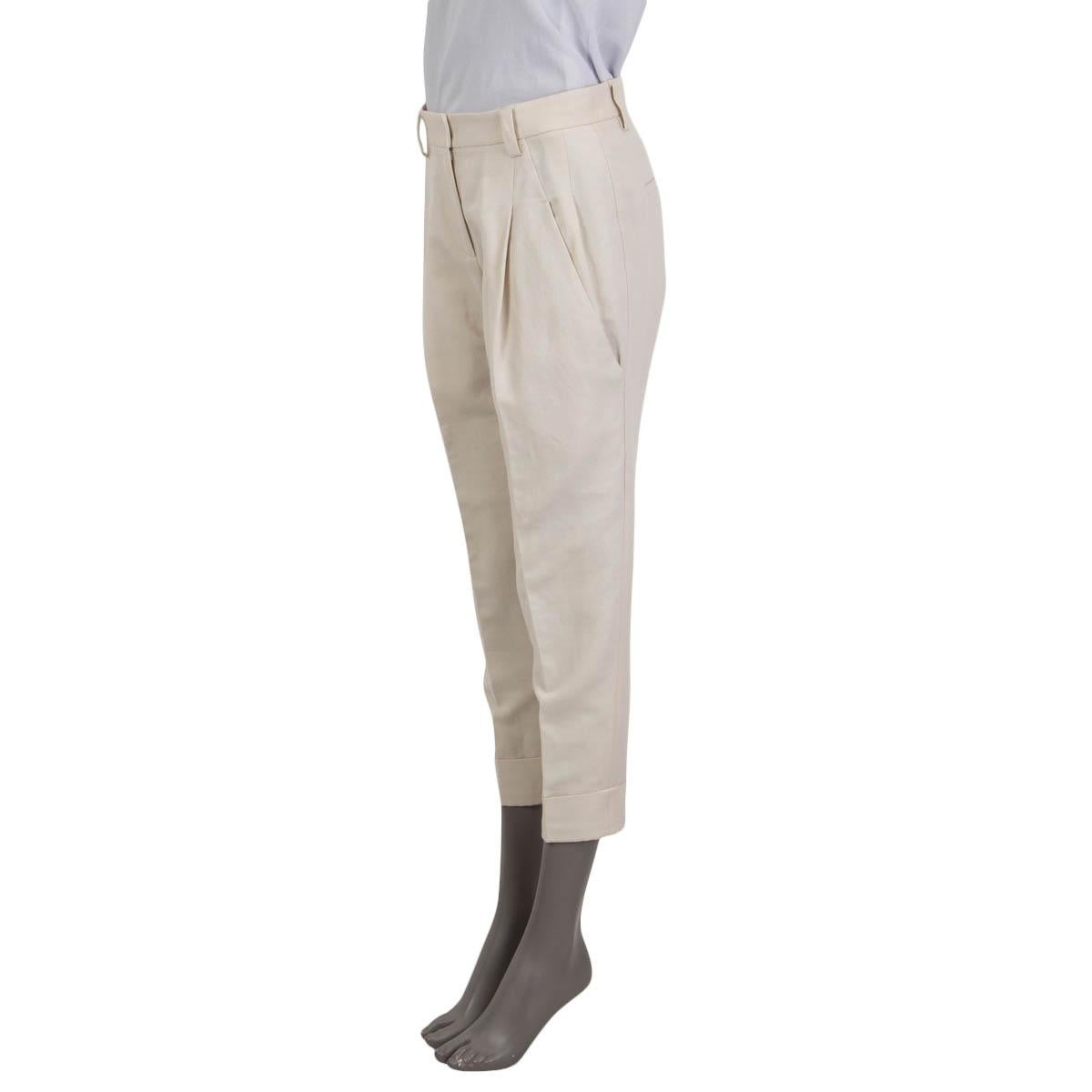100% authentic Brunello Cucinelli pleated pants in ivory cotton and (72%) and linen (28%). The design has two slit pockets on the side and on the pack and turn-ups on the bottom. Has been worn and are in excellent condition. 

Measurements
Tag
