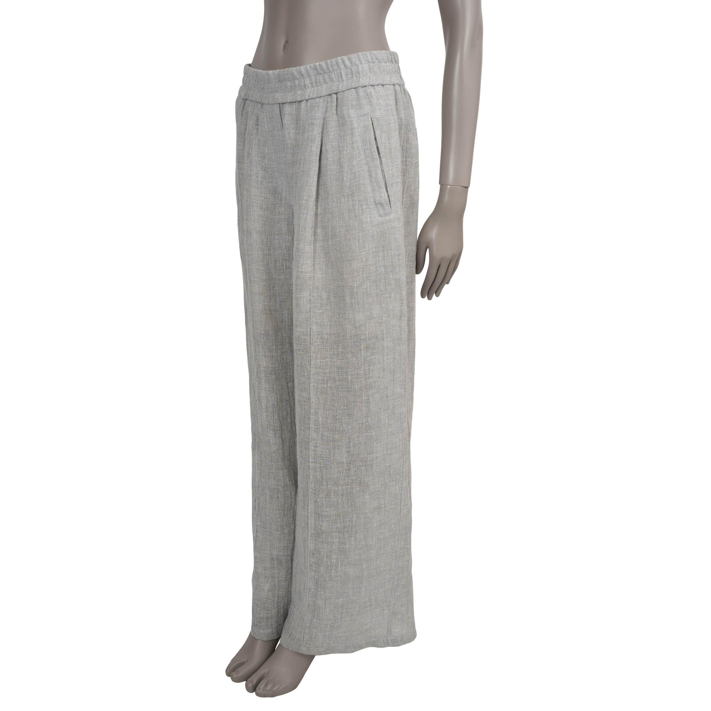 These 100% authentic Brunello Cucinelli pants in Grigio light grey lightweight crinkled linen (90%) and polyamide (10%) offer an effortlessly breezy silhouette perfect for warm-weather dressing. Designed with a high waist and wide legs, they feature