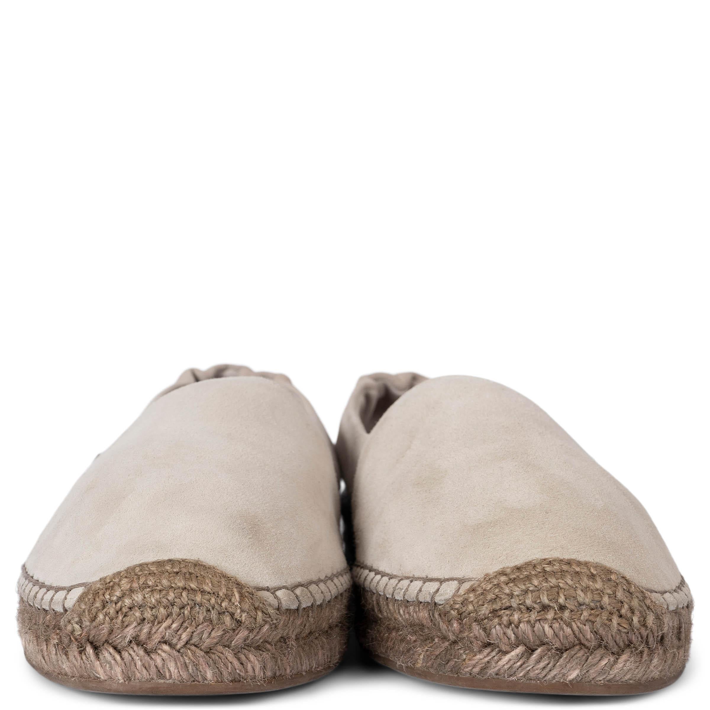 These 100% authentic Brunello Cucinelli espadrilles are crafted from light taupe suede and feature an elastic heel for a comfortable fit. Accented with a signature Monili beads tab, they sit on classic jute soles with rubber soles for added