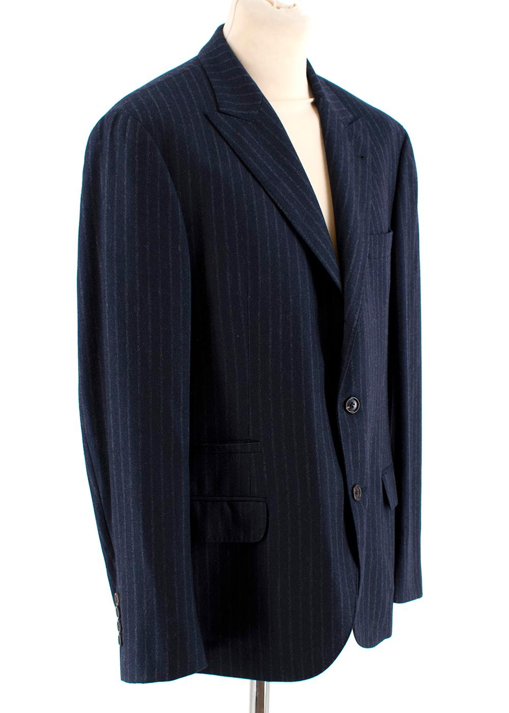 Brunello Cucinelli Mens Navy Pin Striped Blazer

- Vertical pin striped weave
- Mid weight material
- Brown silk lining
- Semi padded shoulders
- Flap pockets on both sides
- Single breasted with 2 larger tortoise shell buttons & smaller buttons on