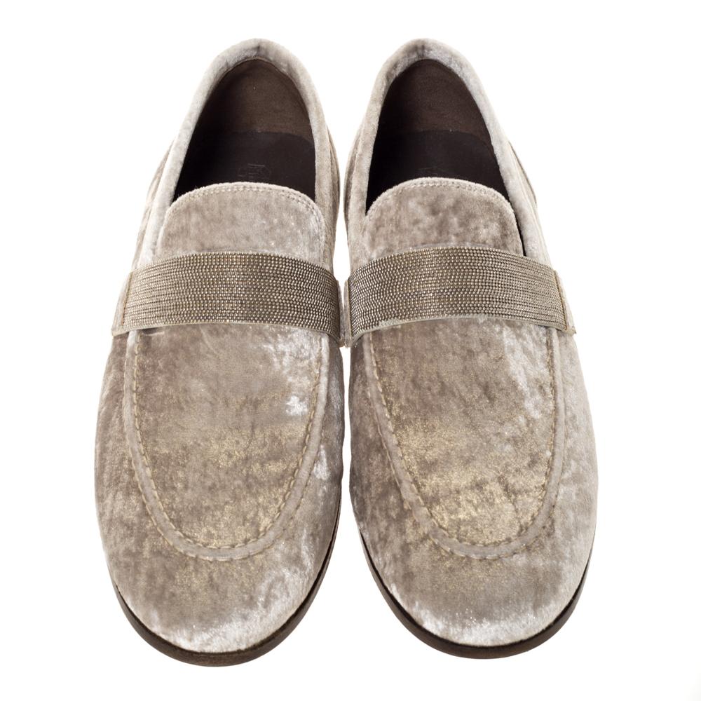 Brunello Cucinelli shoes will definitely make it to your most coveted item in your closet. These loafers have a slip-on style, metallic beige exterior crafted from luxurious velvet and round toes. They have bands on the uppers, leather soles and