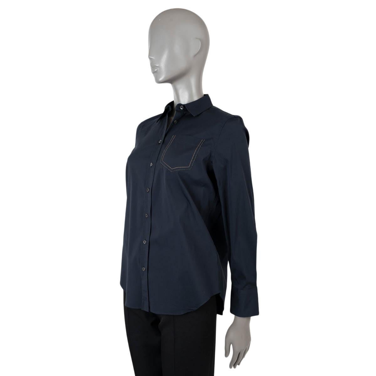 100% authentic Brunello Cucinelli poplin shirt in navy blue cotton (72%), polyamide (23%) and elastane (5%). Features a Monili trimmed open chest pocket. Closes with buttons down the front. Has been worn and is in excellent condition.