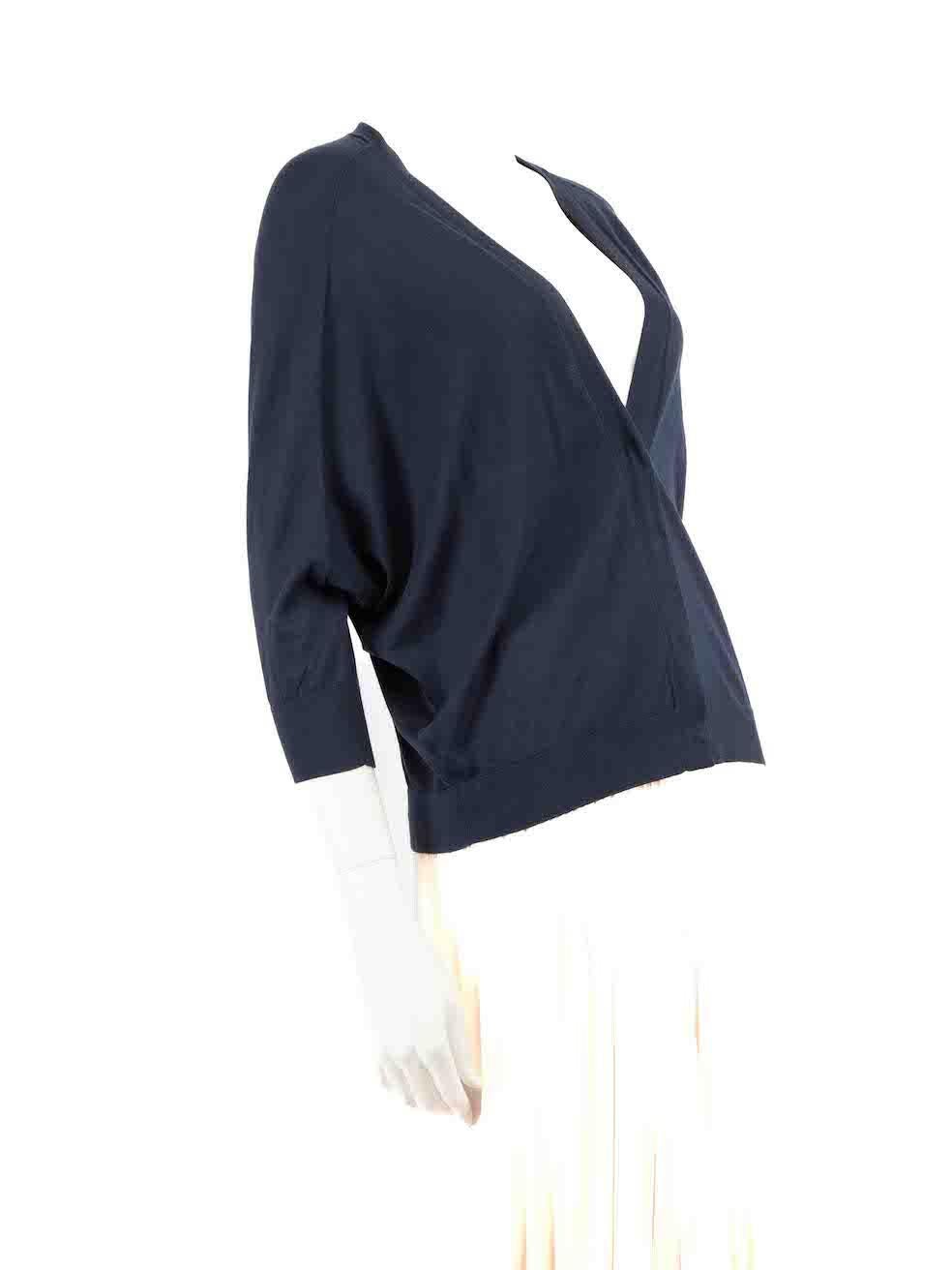 CONDITION is Very good. Minimal wear to cardigan is evident. The snap buttons are becoming loose on this used Brunello Cucinelli designer resale item.
 
 
 
 Details
 
 
 Navy
 
 Cotton
 
 Knit cardigan
 
 V-neck
 
 Snap button fastening
 
 
 
 
 
