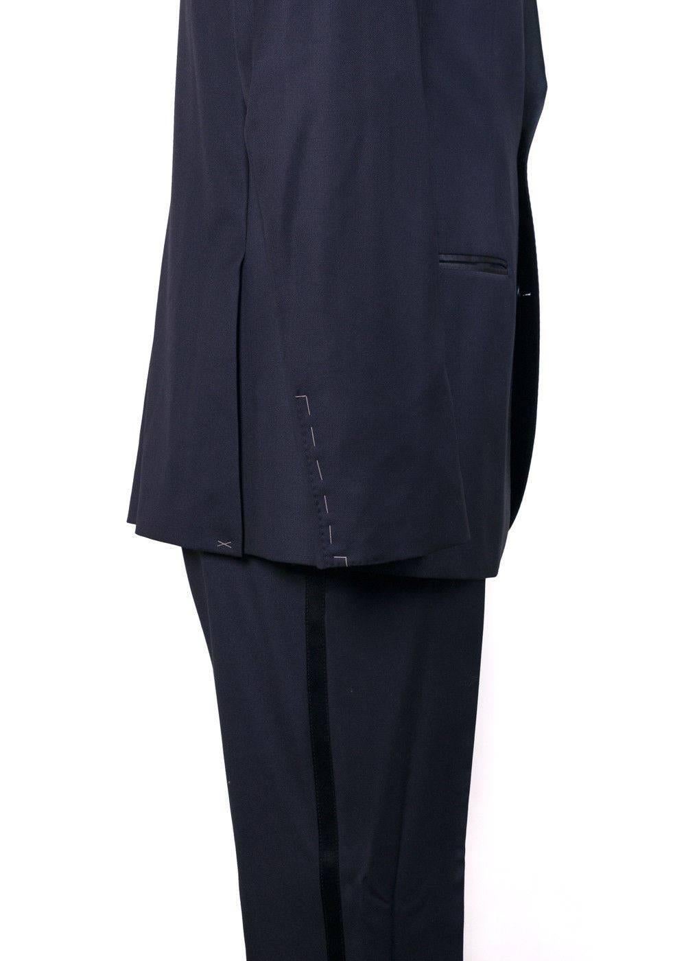 Brand New Brunello Cucinelli Satin Lapel Suit
Retails in Stores & Online for $7795
Men's Size EUR 54 R / US 44 R Fits True to Size

Adopt that air of deserving confidence in your Brunello Cucinellli Suit. This rich navy suit features a handsome