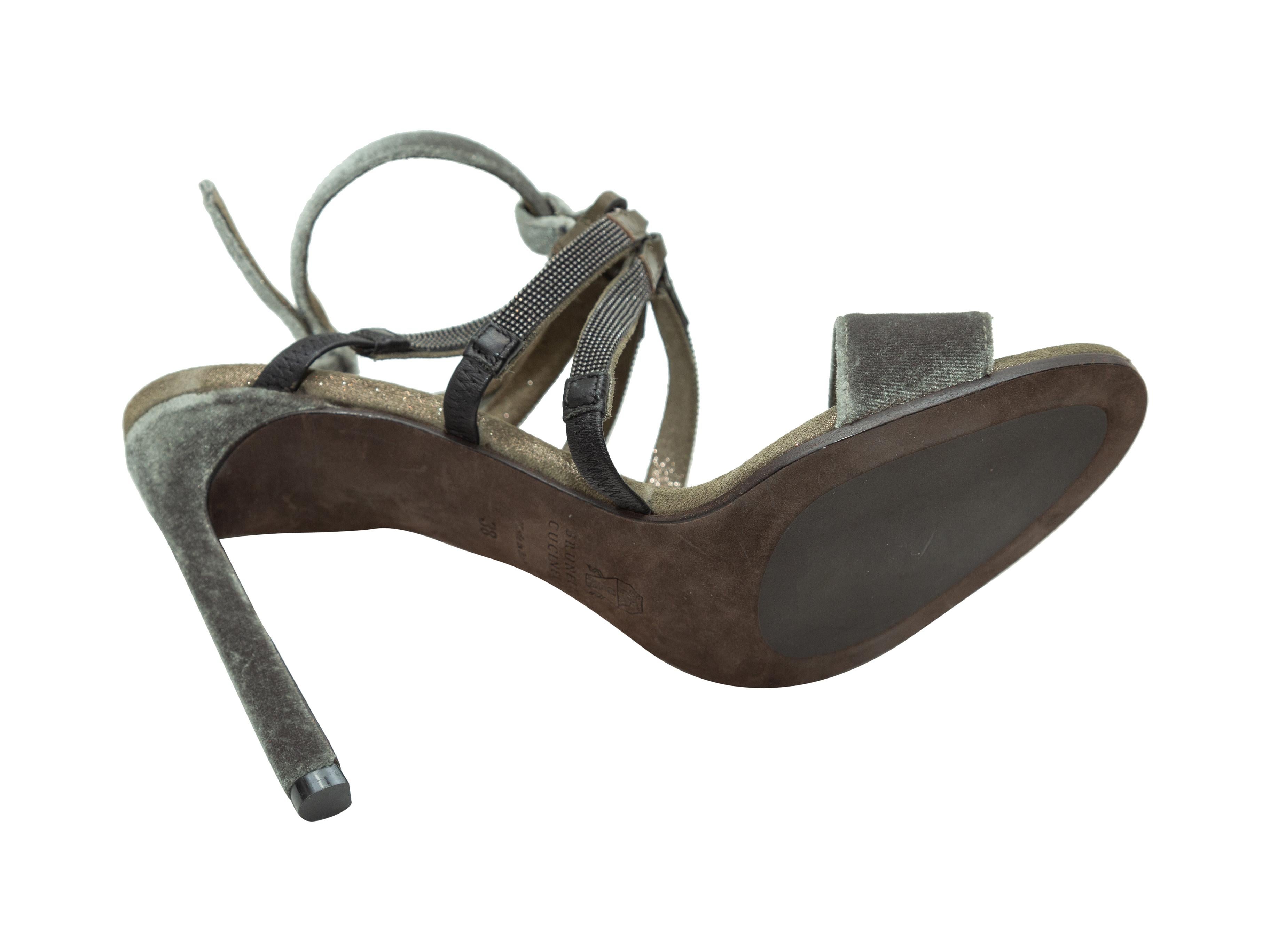 Product details: Olive green velvet sandals by Brunello Cucinelli. Silver-tone Monili embellishments at tops. Buckle closures at ankles.
Condition: Pre-owned. Very good.
Est. Retail $ 922.00