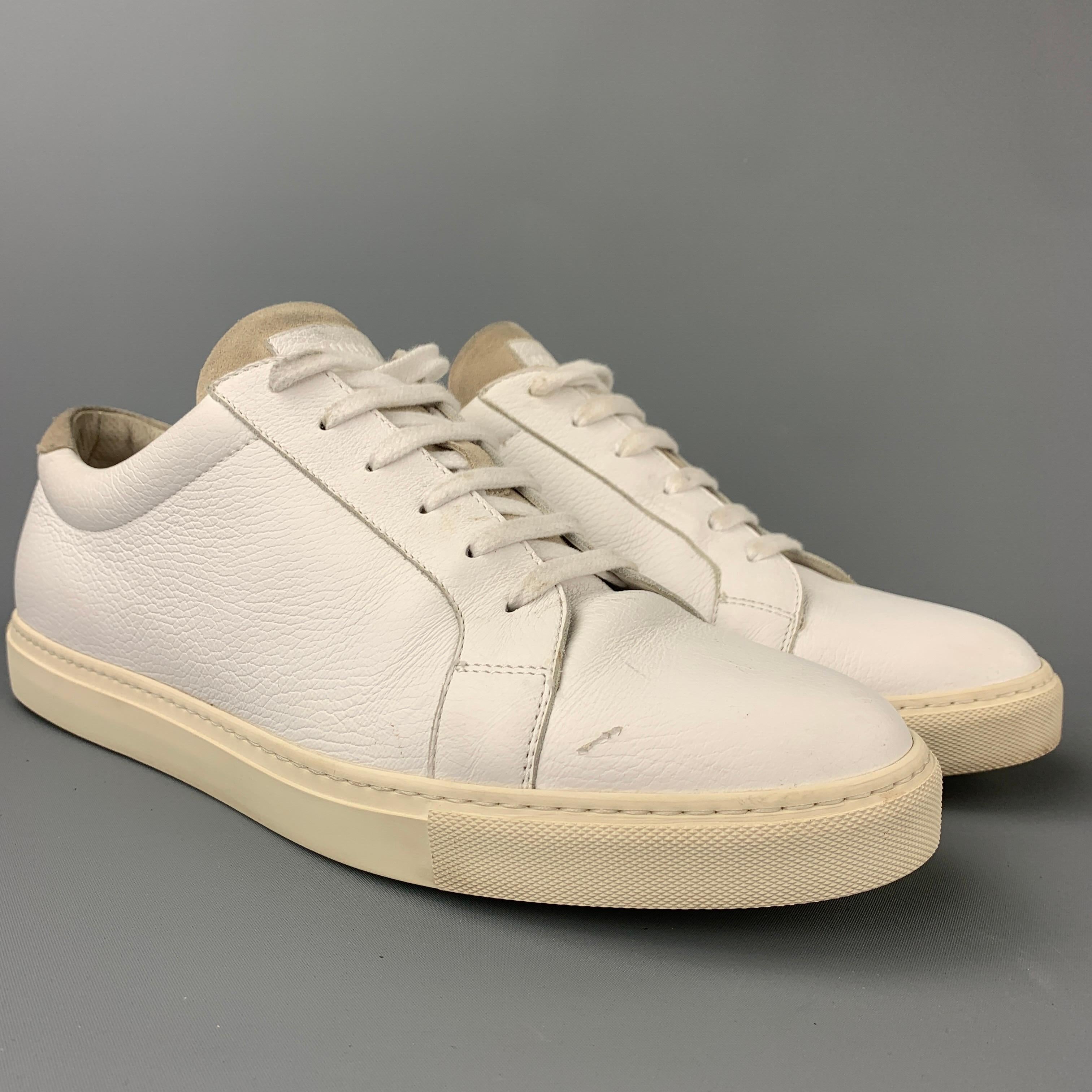 BRUNELLO CUCINELLI sneakers comes in a white leather featuring a low top style, rubber sole, and a lace up closure. Made in Italy.

Very Good Pre-Owned Condition.
Marked: EU 46
Original Retail Price: $745.00

Outsole: 12.5 in. x 4 in. 