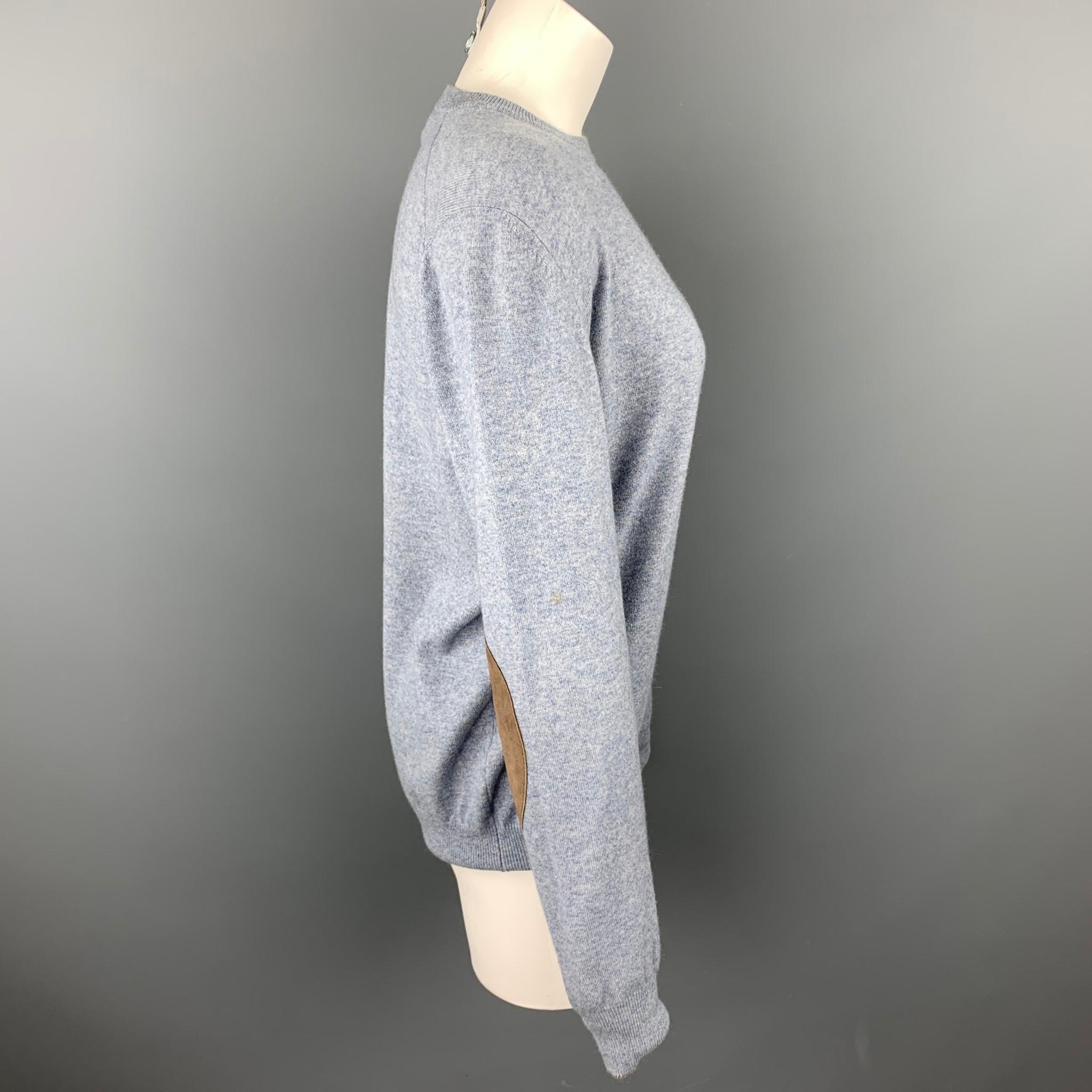 BRUNELLO CUCINELLI sweater comes in a blue cashmere with suede elbow patches featuring a ribbed crew-neck. Made in Italy.

Very Good Pre-Owned Condition.
Marked: 50
Original Retail Price: $895.00

Measurements:

Shoulder: 17 in. 
Bust: 42