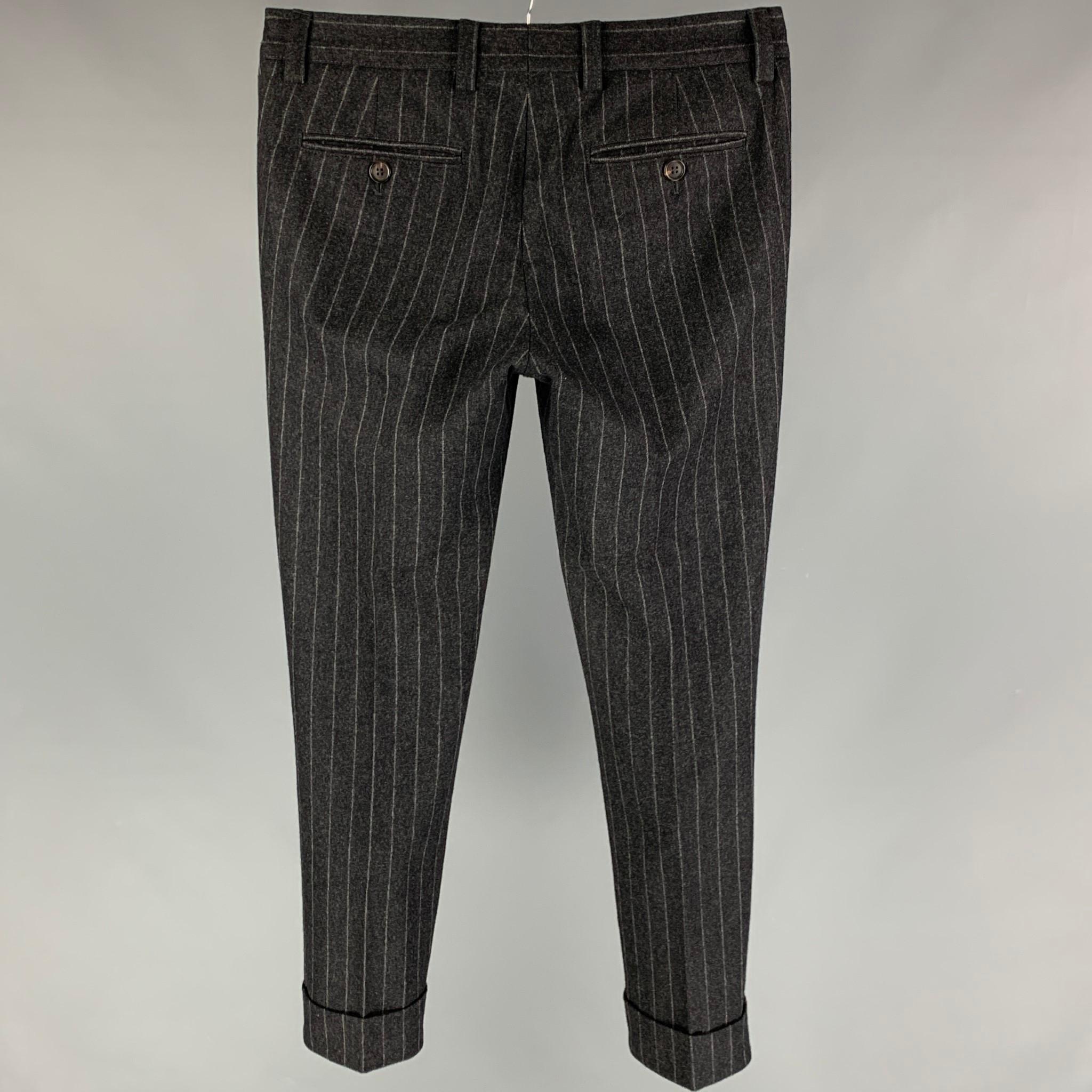 BRUNELLO CUCINELLI dress pants comes in a grey chalk stripe wool featuring a pleated style, cuffed leg, and a zip fly closure. Made in Italy. 

Very Good Pre-Owned Condition.
Marked: 48

Measurements:

Waist: 32 in.
Rise: 9 in.
Inseam: 30 in. 

