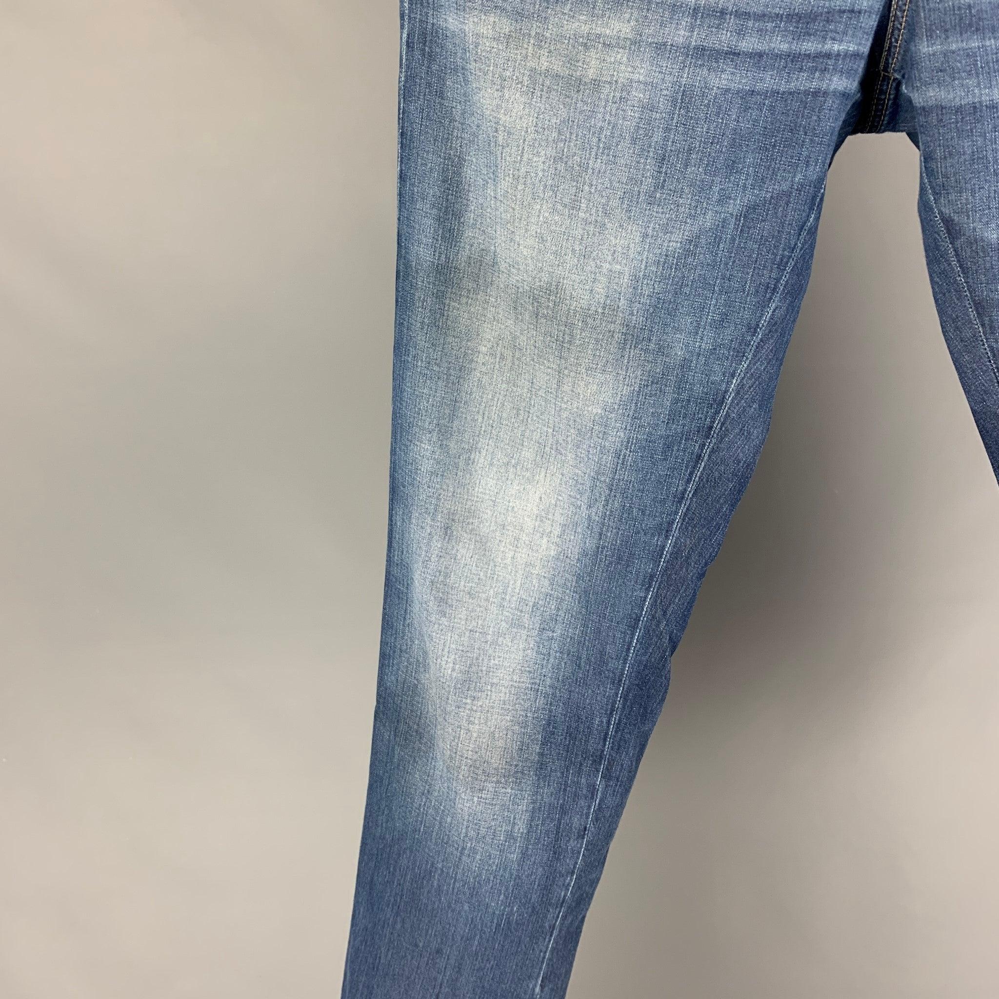 BRUNELLO CUCINELLI jeans comes in a blue washed cotton featuring a slim fit, contrast stitching, and a button fly closure. Made in Italy.
Good Pre-Owned Condition. Minor discoloration at top. As-is.  

Marked:   50 

Measurements: 
  Waist: 34