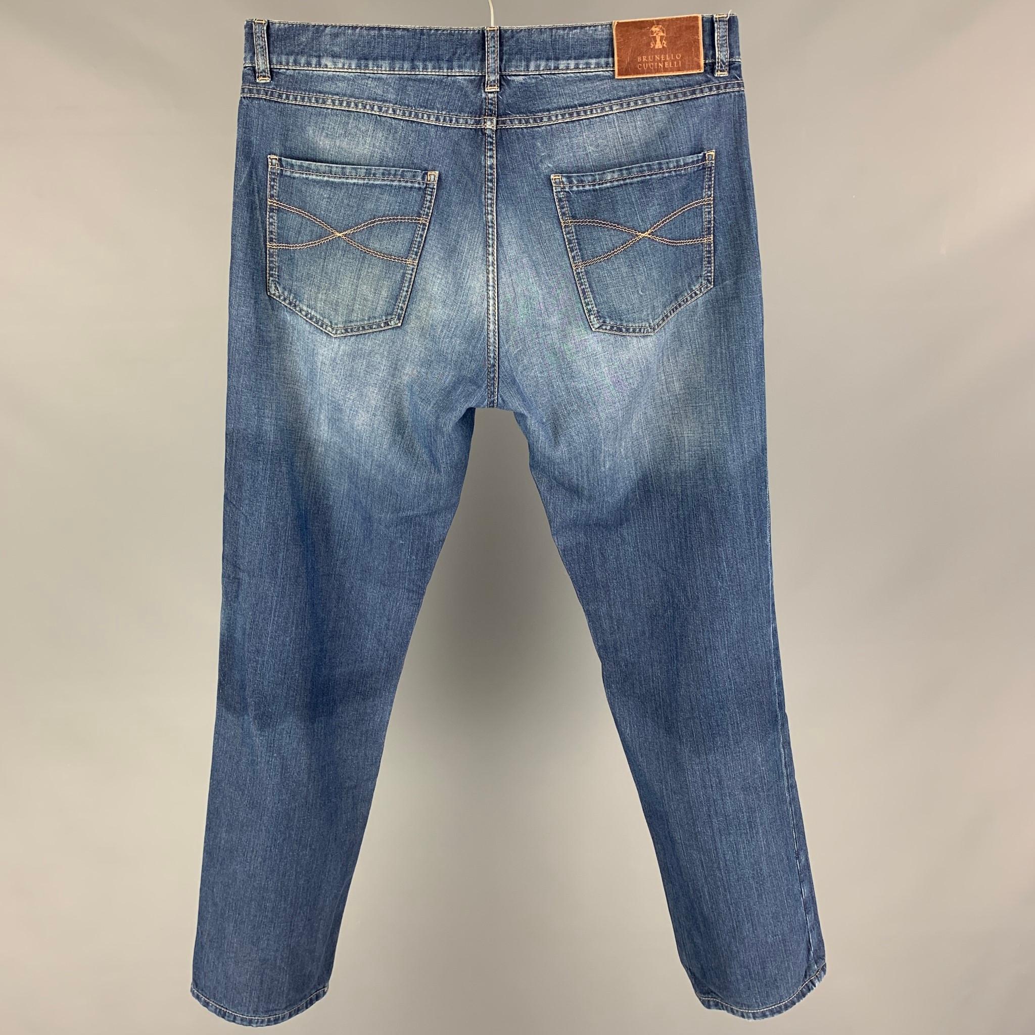 BRUNELLO CUCINELLI jeans comes in a blue washed cotton featuring a slim fit, contrast stitching, and a button fly closure. Made in Italy. 

Good Pre-Owned Condition. Minor discoloration at top. As-is.
Marked: 50
Original Retail Price: