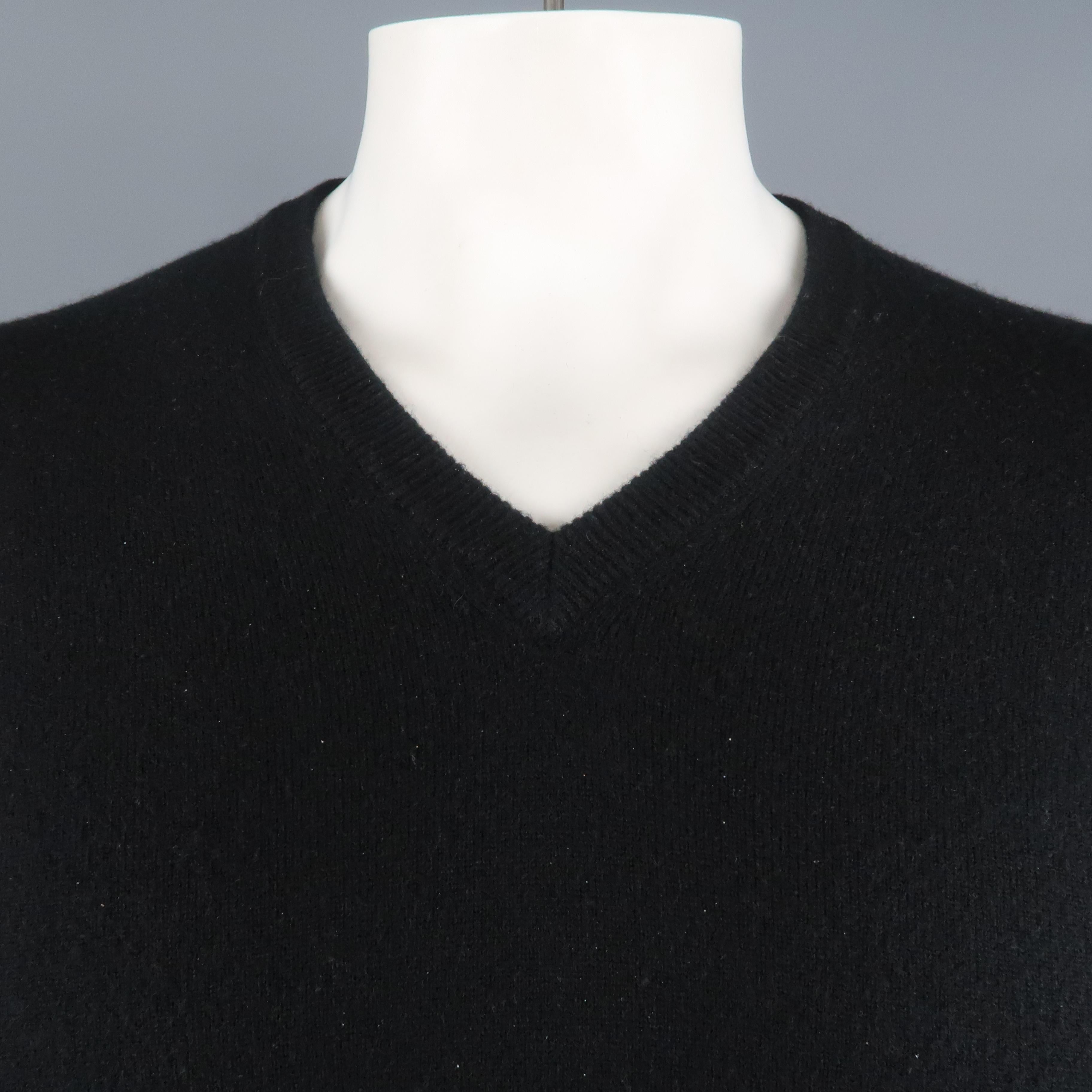 BRUNELLO CUCINELLI sweater comes in a black cashmere featuring a v-neck. Made in Italy.
 
Very Good Pre-Owned Condition.
Marked: IT 46
 
Measurements:
 
Shoulder: 17.5 in.
Chest: 42 in.
Sleeve: 25.5 in.
Length: 24.5 in.