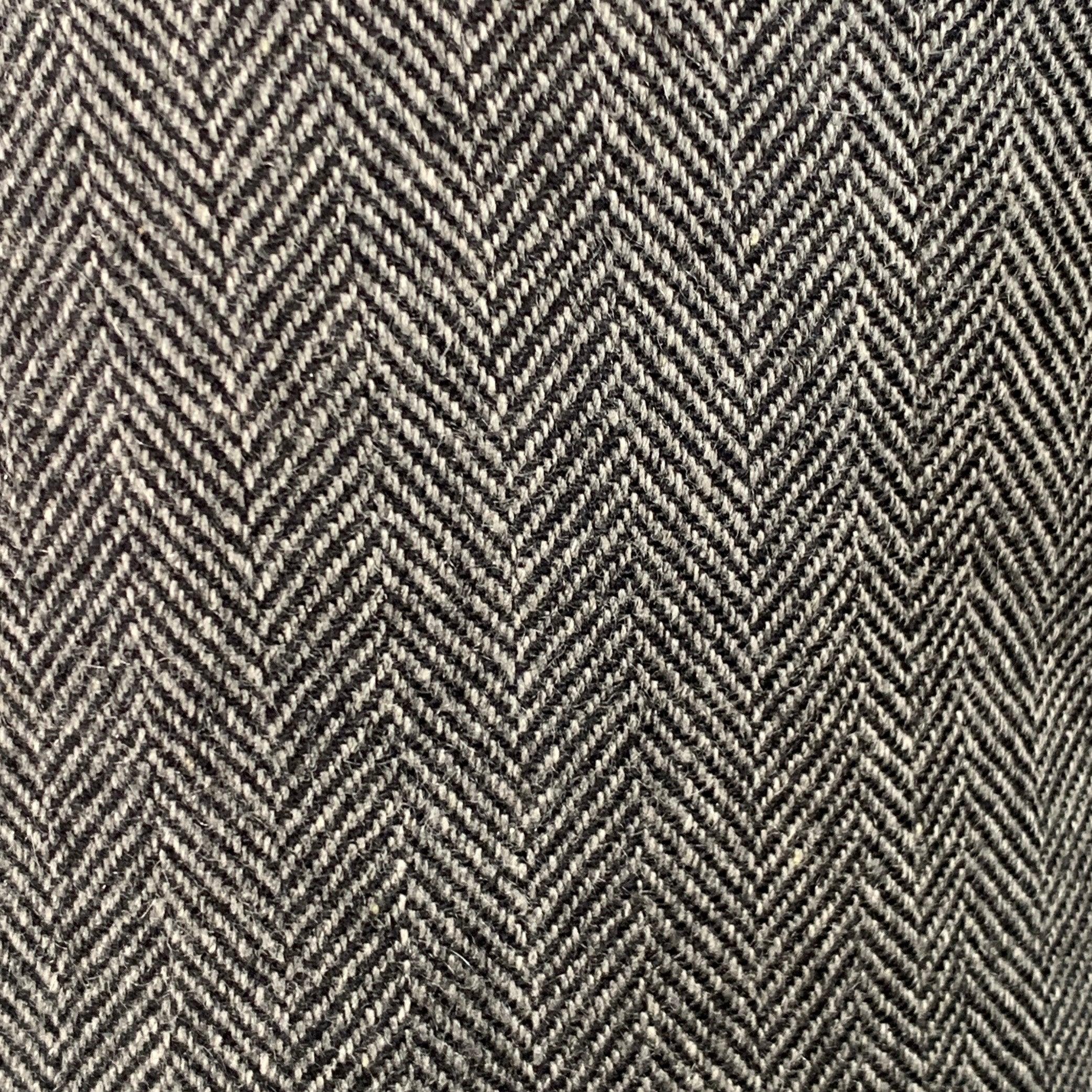 BRUNELLO CUCINELLI sport coat in a grey and black cashmere featuring a herringbone pattern, notch lapel, double vented back, and three button closure. Note: the sleeves on this garment have been professionally altered and are slightly uneven in