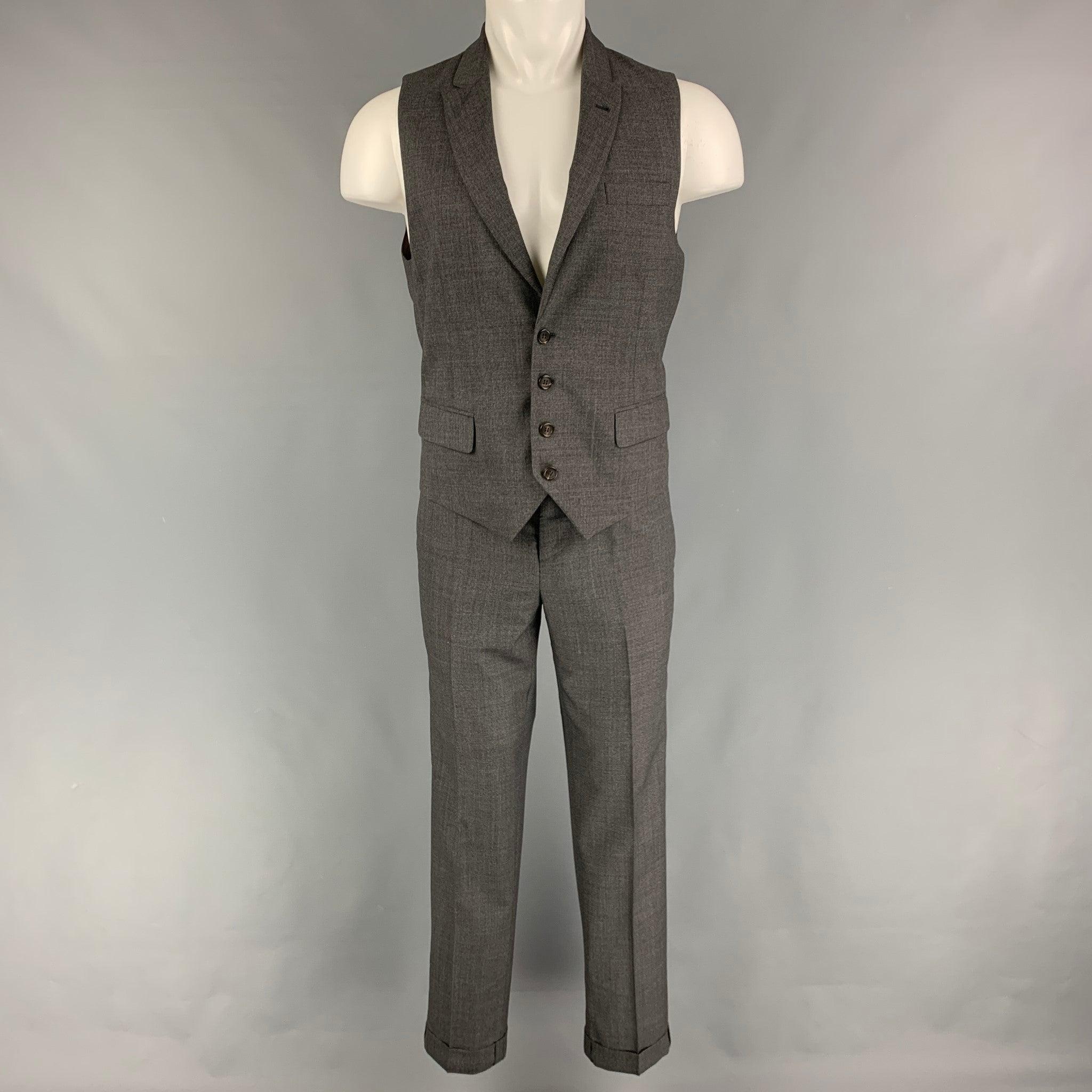 BRUNELLO CUCINELLI vest
suit comes in a grey wool and includes a single breasted, four button dress vest with a peak lapel and matching flat front trousers. Made in Italy. Very Good Pre-Owned Condition. 

Marked:   Pants / 46 

Measurements: 
 