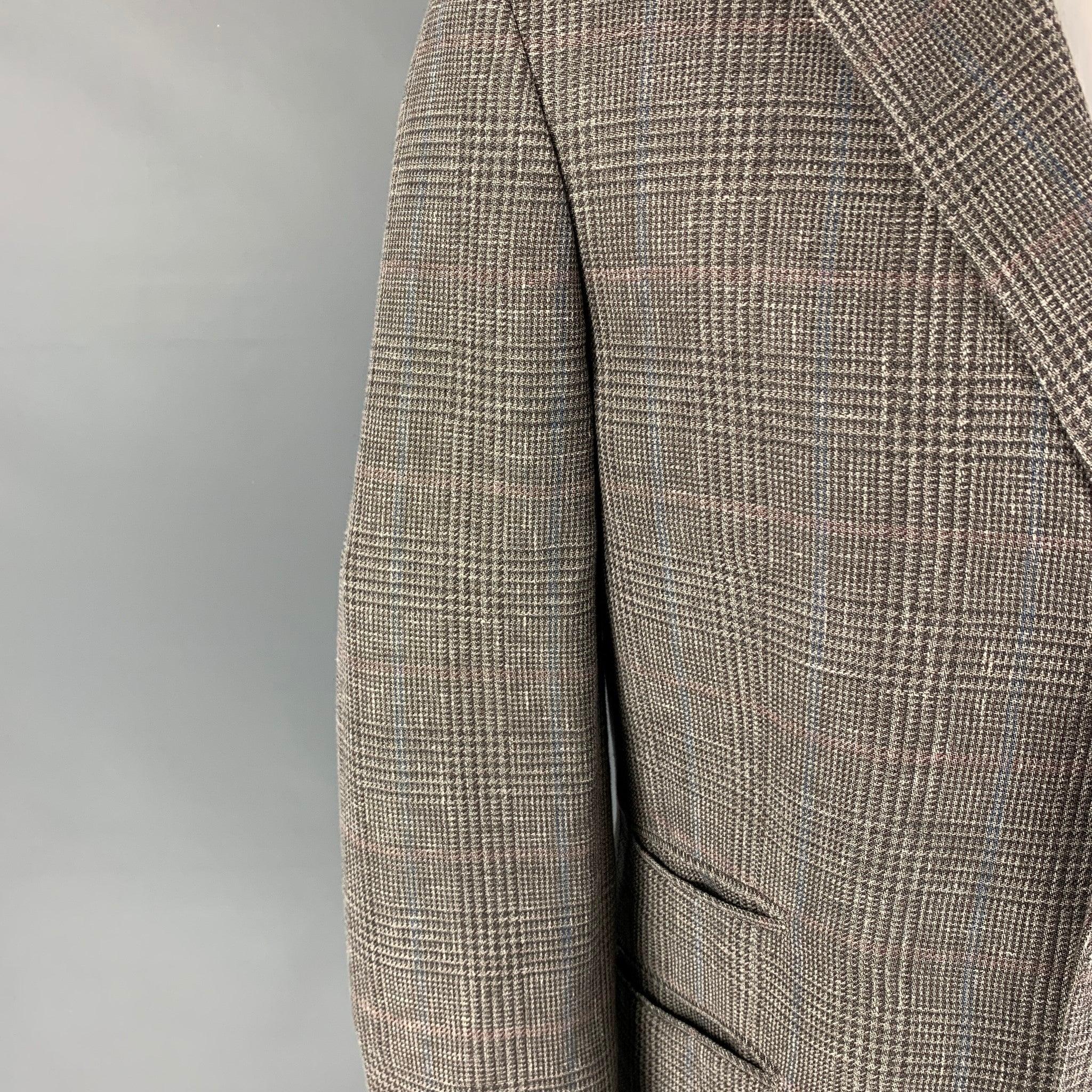 BRUNELLO CUCINELLI sport coat comes in a green glenplaid wool with a half liner featuring a notch lapel, slit pockets, double back vent, and a three button closure. Excellent
Pre-Owned Condition. 

Marked:   50 

Measurements: 
 
Shoulder: 18 inches