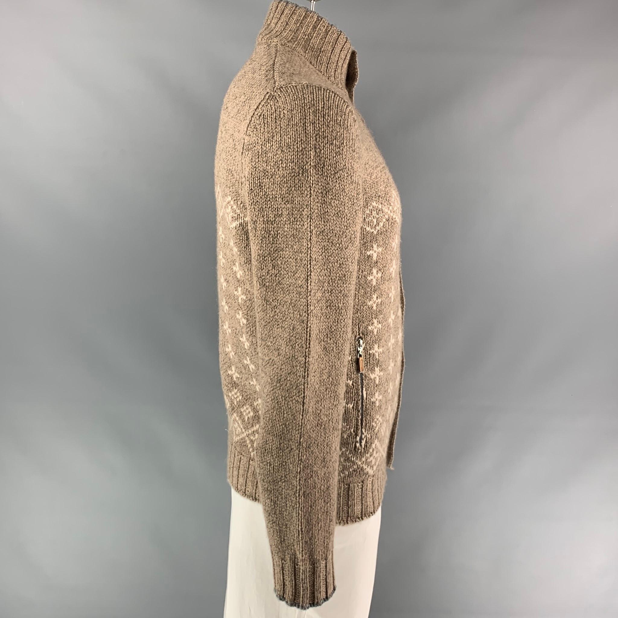 BRUNELLO CUCINELLI jacket comes in a oatmeal fairisle cashmere featuring a high collar, zipper pockets, and a buttoned closure. Made in Italy.

Very Good Pre-Owned Condition.
Marked: 52

Measurements:

Shoulder: 16 in.
Chest: 42 in.
Sleeve: 28.5