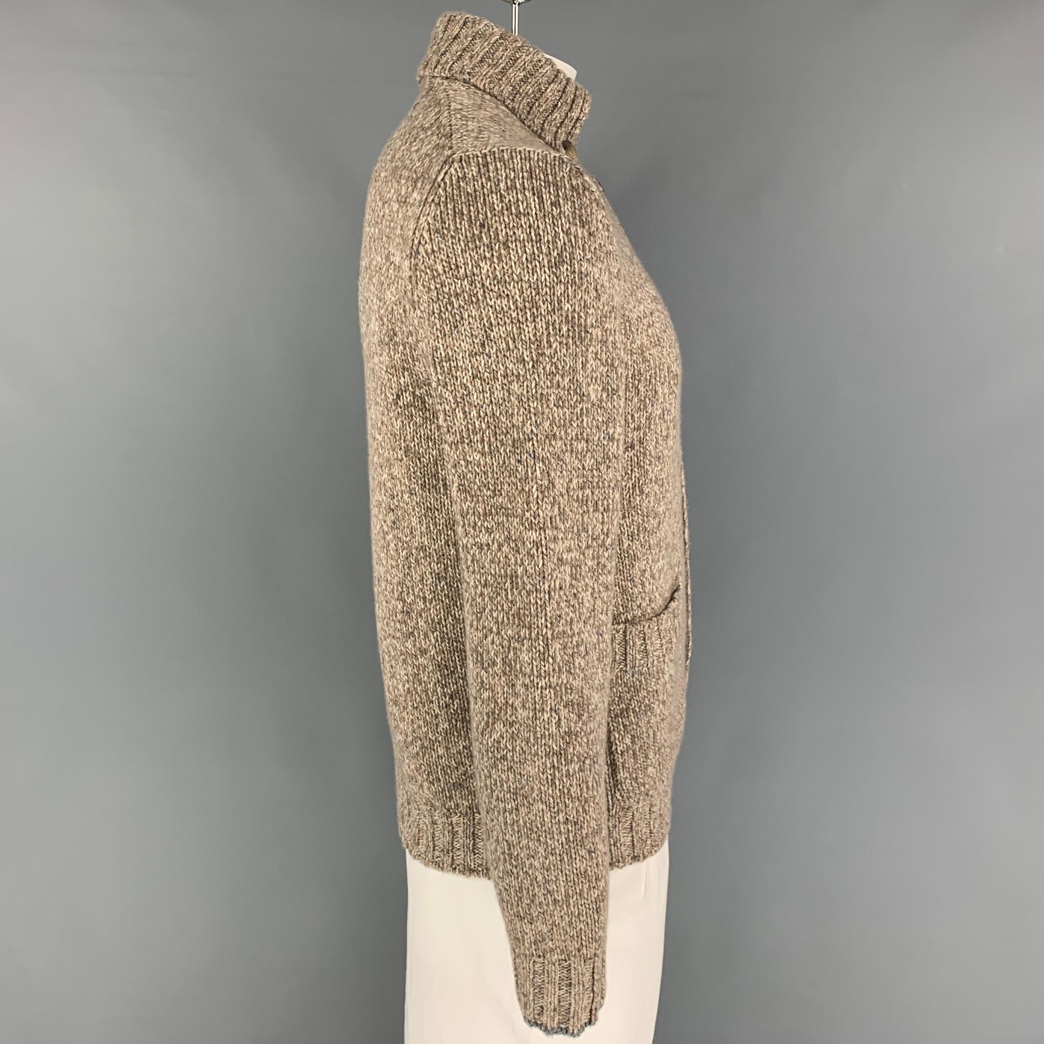 BRUNELLO CUCINELLI cardigan comes in a taupe & cream knitted cashmere featuring a button down collar, patch pockets, and a buttoned closure. Made in Italy. 

Excellent Pre-Owned Condition.
Marked: 52

Measurements:

Shoulder: 17 in.
Chest: 42