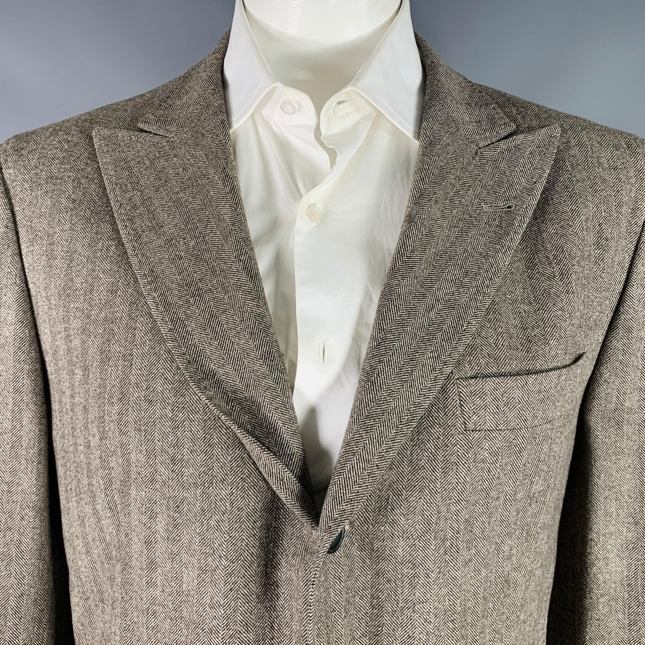 BRUNELLO CUCINELLI sport coat in an oatmeal beige and brown wool cashmere blend fabric featuring peak lapel, double vented back, and three button fold closure. Made in Italy.Excellent Pre-Owned Condition. 

Marked:   54 

Measurements: 
 
Shoulder:
