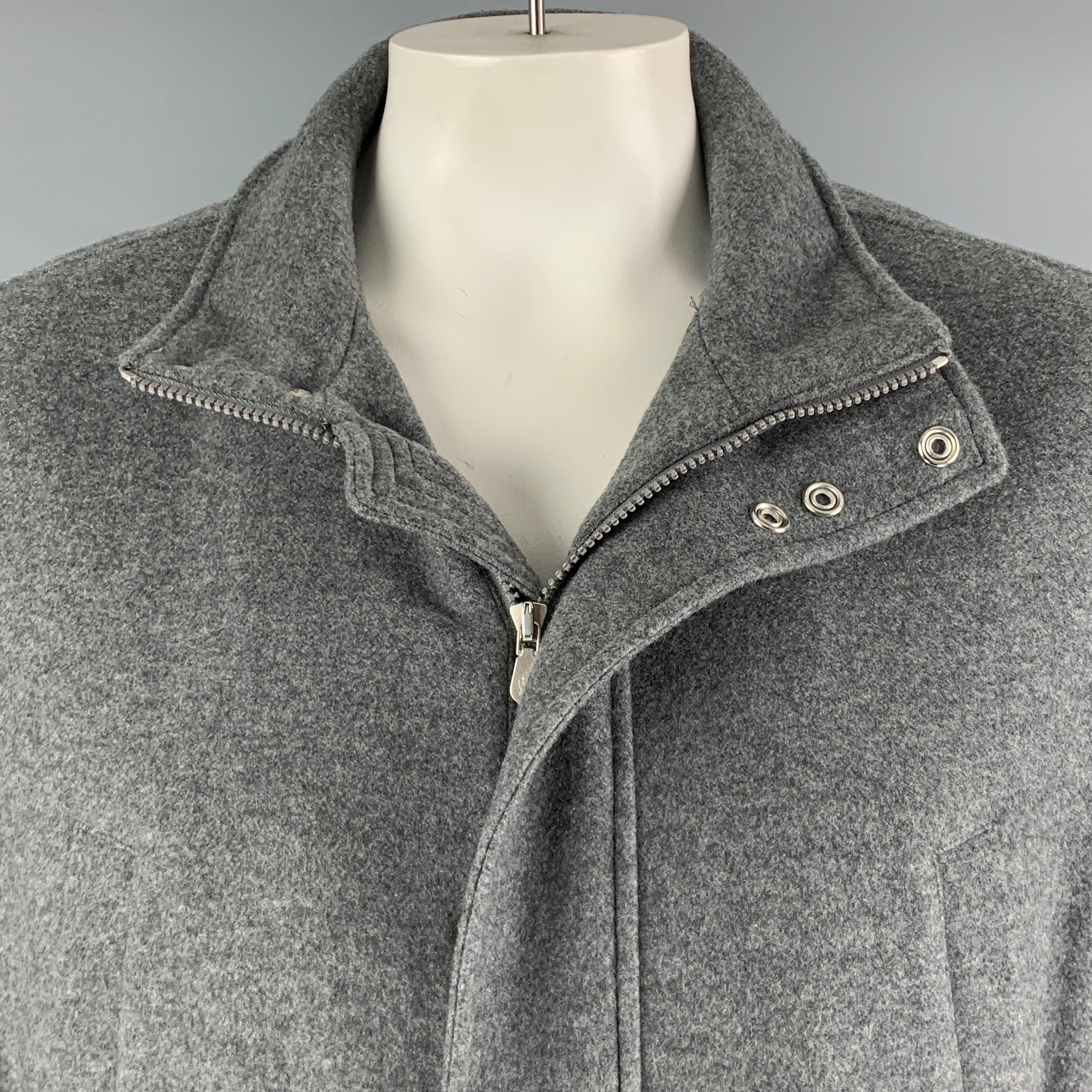 BRUNELLO CUCINELLI jacket
in a
grey cashmere fabric featuring a detachable hood, and zip & snaps closure. Made in Italy.Excellent Pre-Owned Condition. 

Marked:   56 

Measurements: 
 
Shoulder: 18 inches Chest: 47 inches Sleeve: 26 inches Length: