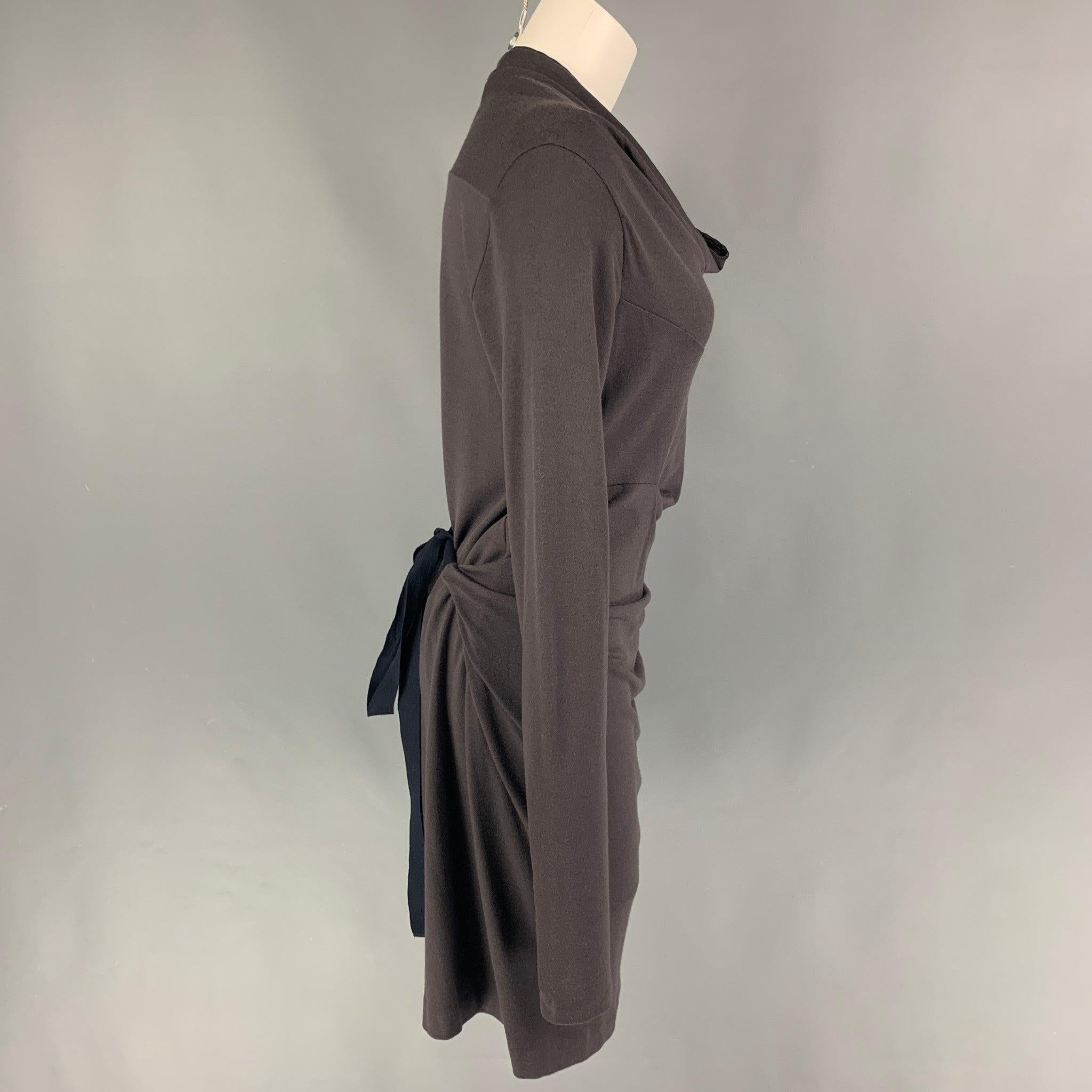 BRUNELLO CUCINELLI dress comes in a taupe jersey material featuring long sleeves, draped neckline, and a belted detail.
Very Good
Pre-Owned Condition. 

Marked:   42 

Measurements: 
 
Shoulder: 15 inches  Bust: 36 in Waist: 36 inches  Sleeve: 31.5