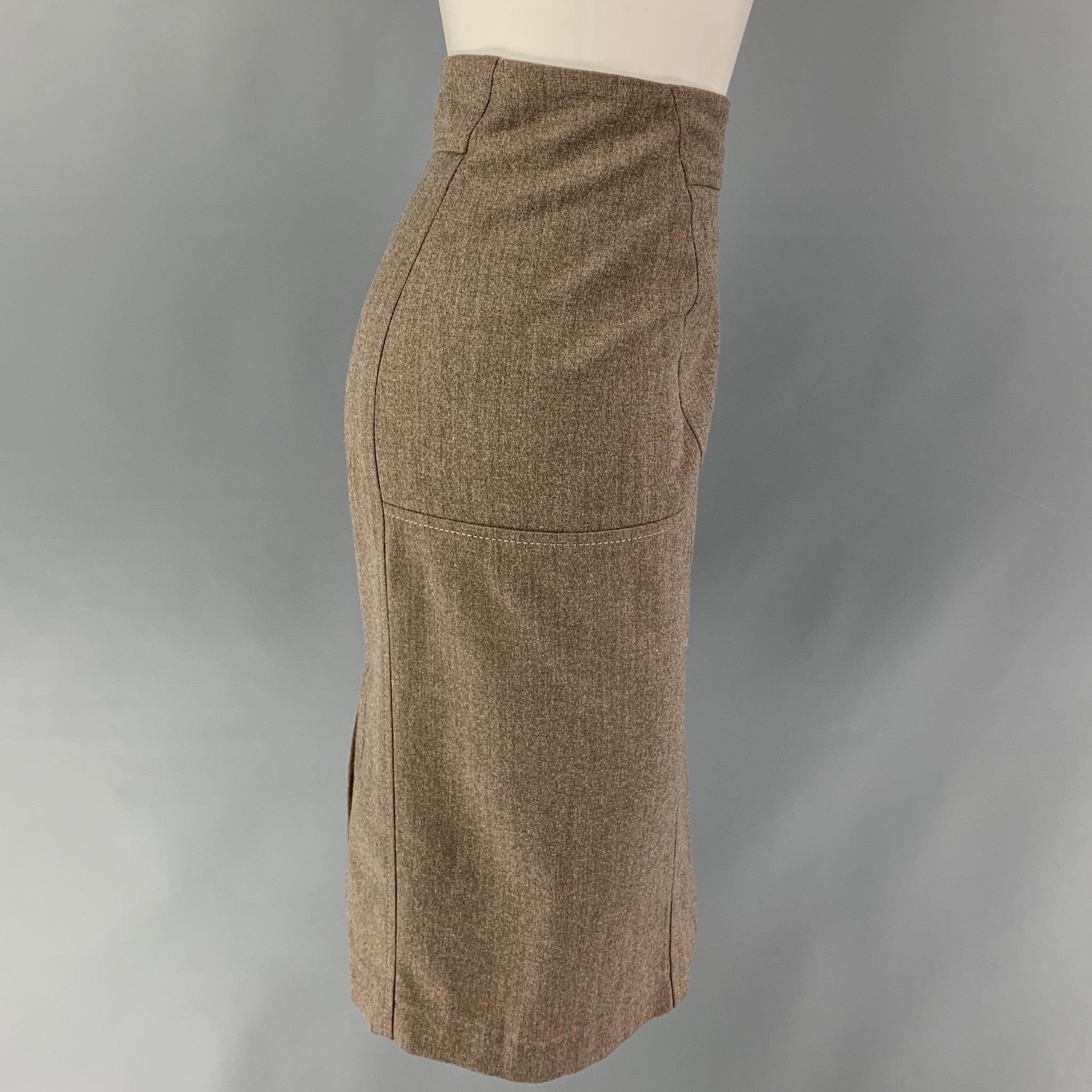 BRUNELLO CUCINELLI skirt comes in a brown heather wool blend featuring a pencil style, back slit, and a back zip up closure. Made in Italy.
Very Good
Pre-Owned Condition. 

Marked:   I 44 / D 38 / F 40 / US 8 

Measurements: 
  Waist: 32 inches 