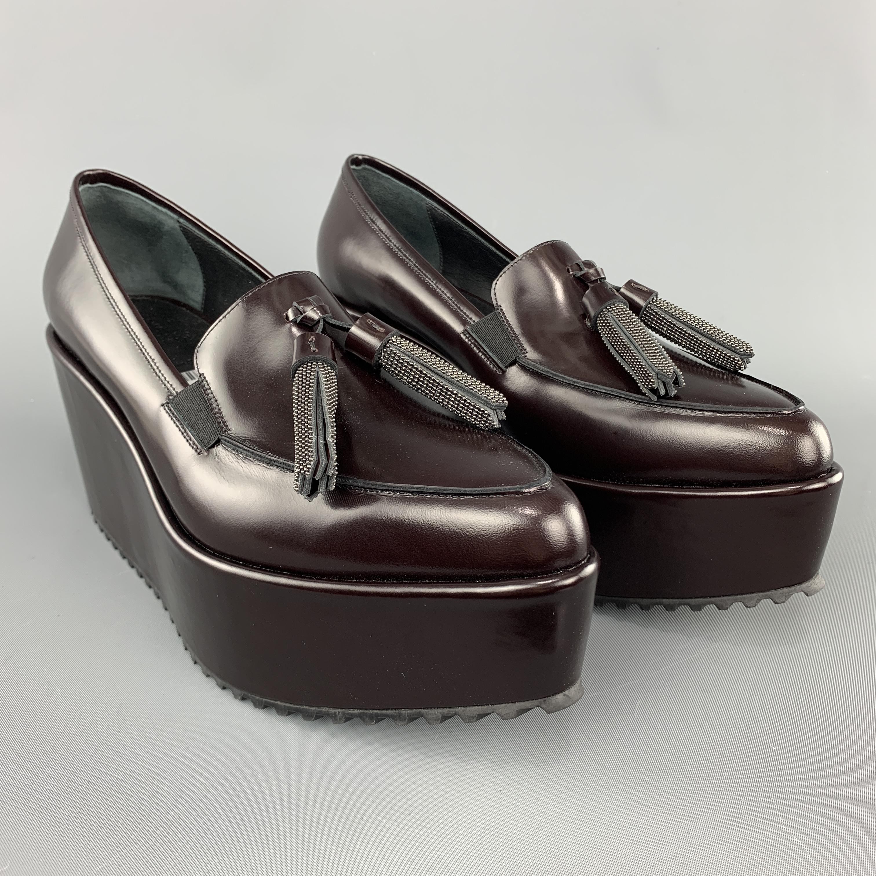 BRUNELLO CUCINELLI loafers come in dark burgundy smooth leather with a pointed apron toe, beaded tassels, and platform sole. Made in Italy.

New with Tags.
Marked: IT 38

Measurements:

Heel: 3 in.
Platform: 2 in.