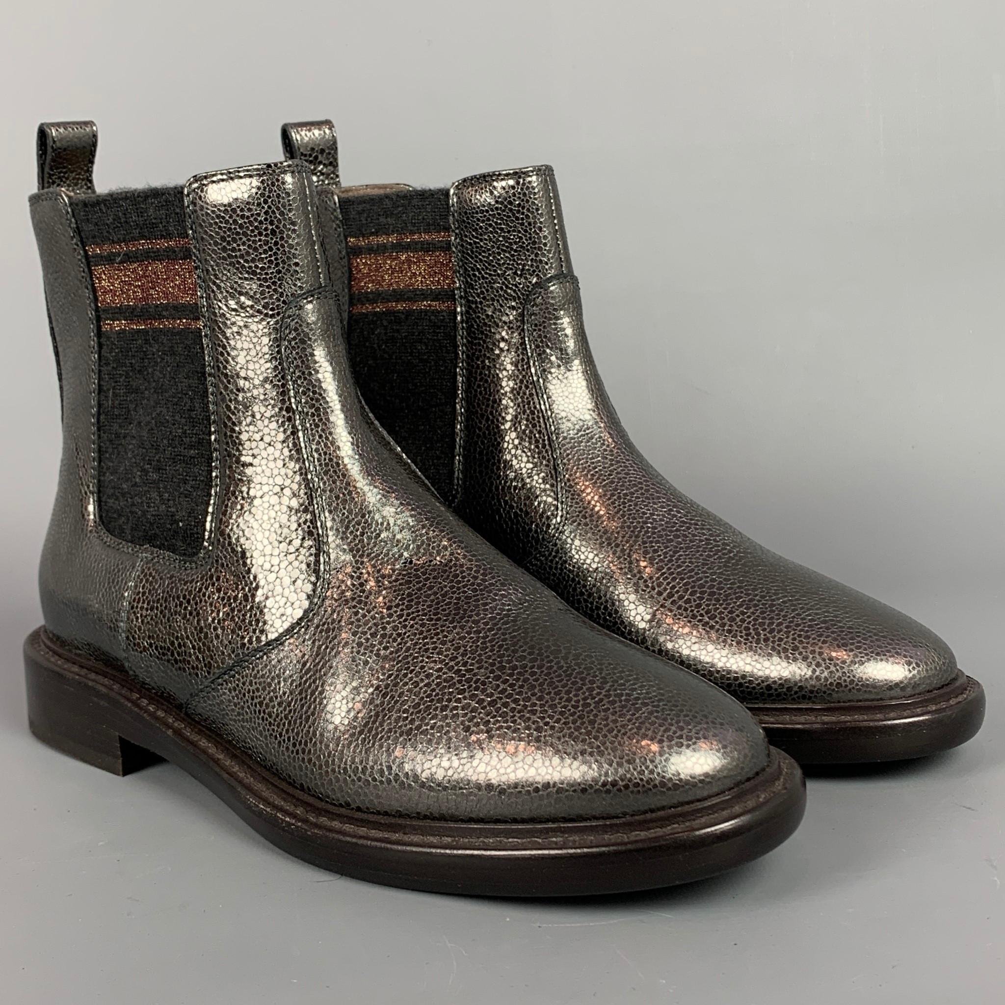 BRUNELLO CUCINELLI boots comes in a pewter & charcoal leather featuring a chelsea style, pull on, gold trim detail, and a wooden sole. Made in Italy.

New Without Tags. 
Marked: IT 38
Original Retail Price: $1,295.00

Measurements:

Length: 10.5
