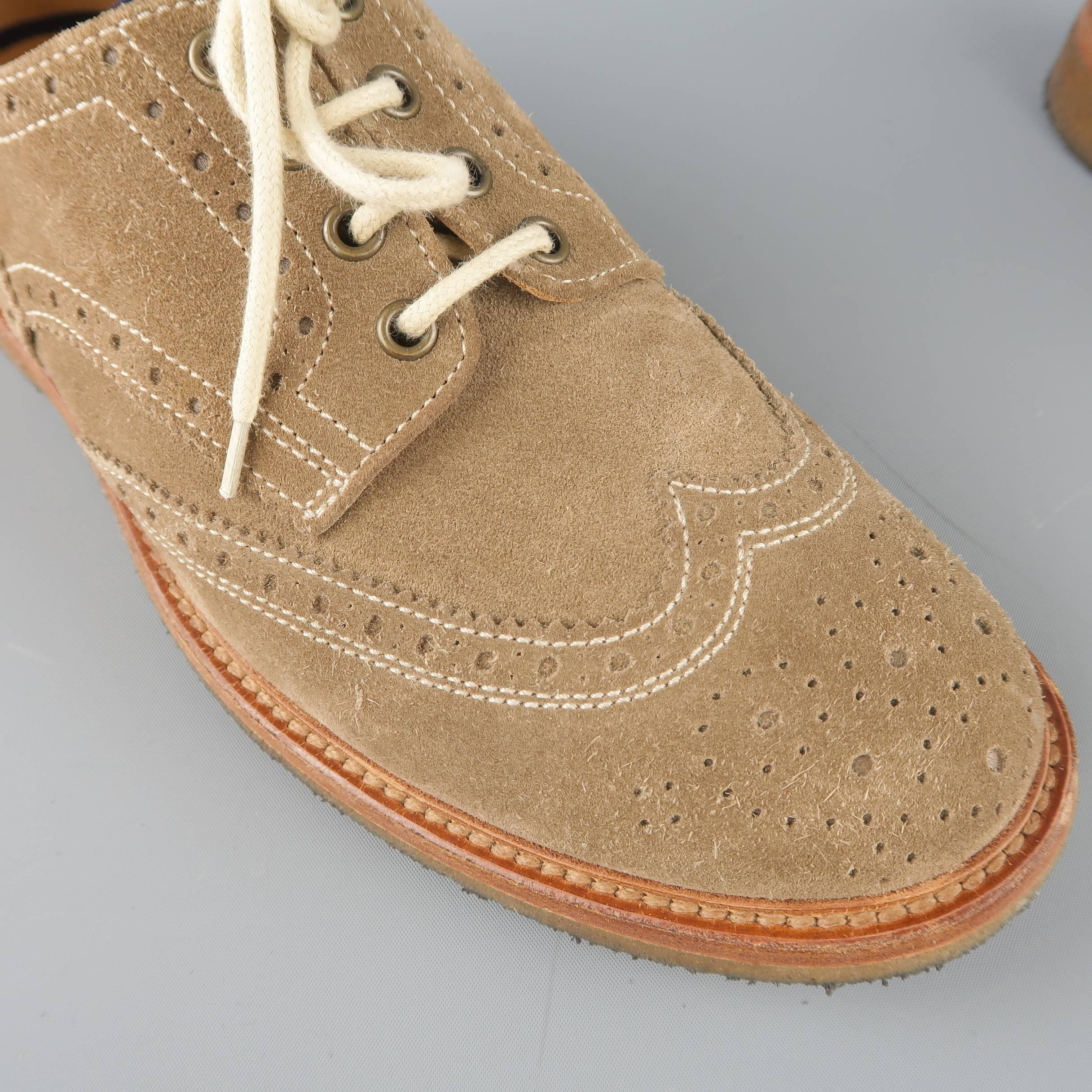 BRUNELLO CUCINELLI dress shoes come in taupe suede with all over perforated brogue details, wingtip toe, and crepe sole. Made in Italy.
 
Good Pre-Owned Condition.
Marked: IT 42.5
 
Outsole: 12 x 4.25 in.
