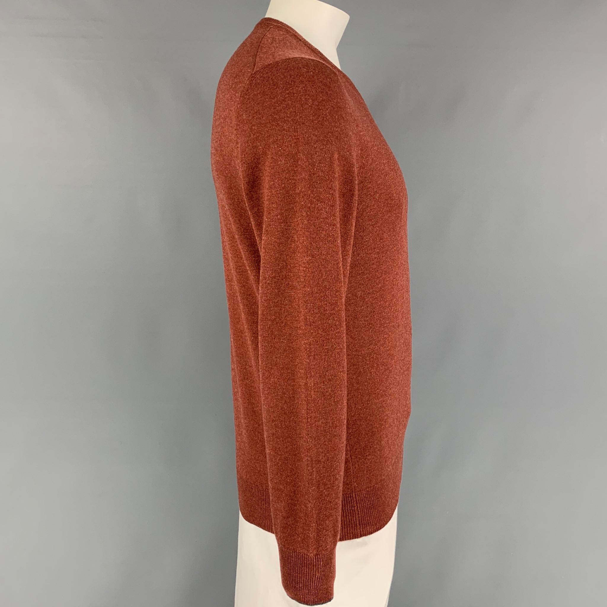 BRUNELLO CUCINELLI sweater comes in a brick knitted cashmere featuring a v-neck. Made in Italy. 

New With Tags. 
Marked: 52

Measurements:

Shoulder:18 in. 
Chest: 42 in.
Sleeve: 27 in.
Length: 27 in. 