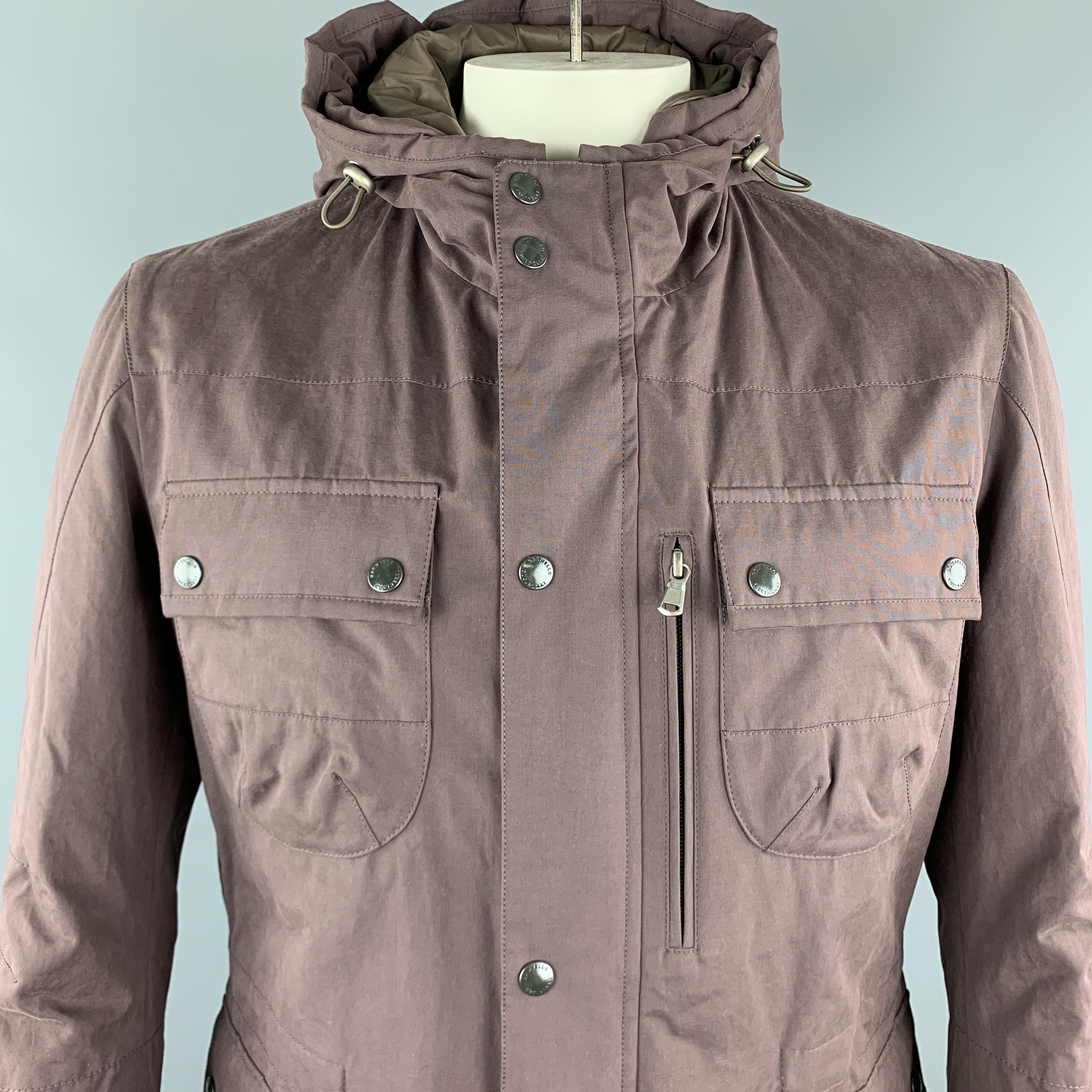 BRUNELLO CUCINELLI Jacket comes in a plum solid cotton blend material, with a hood, patch pockets, zip and snaps at closure, snaps at cuff, single breasted, with a quilted lining. Made in Italy.

New with Tags.
Marked: L

Original Retail Price:
