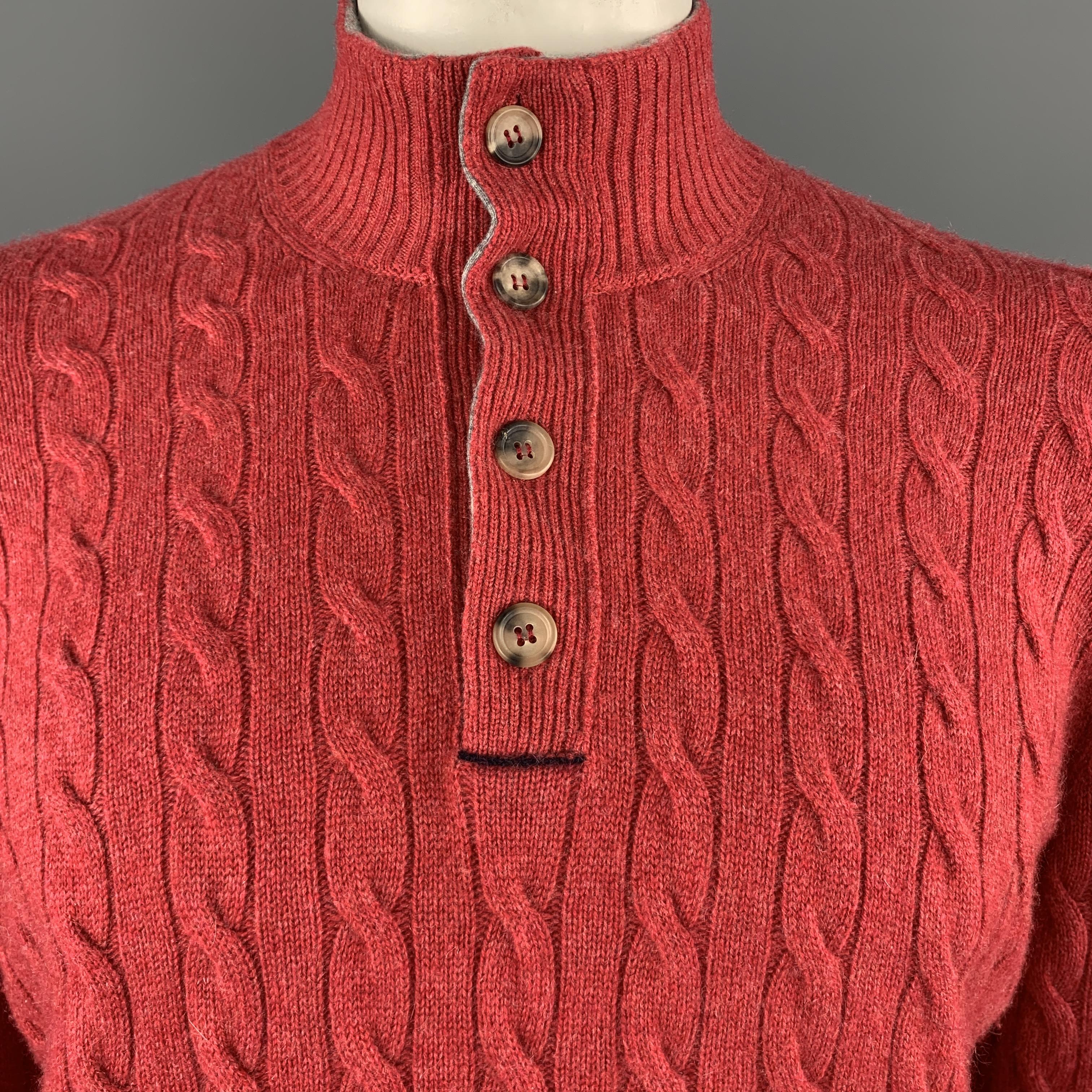BRUNELLO CUCINELLI pullover sweater comes in muted red cashmere cable knit with a high ribbed mock neck collar and half button front. Made in Italy.

Excellent Pre-Owned Condition.
Marked: IT 52

Measurements:

Shoulder: 18 in.
Chest: 46 in.
Sleeve: