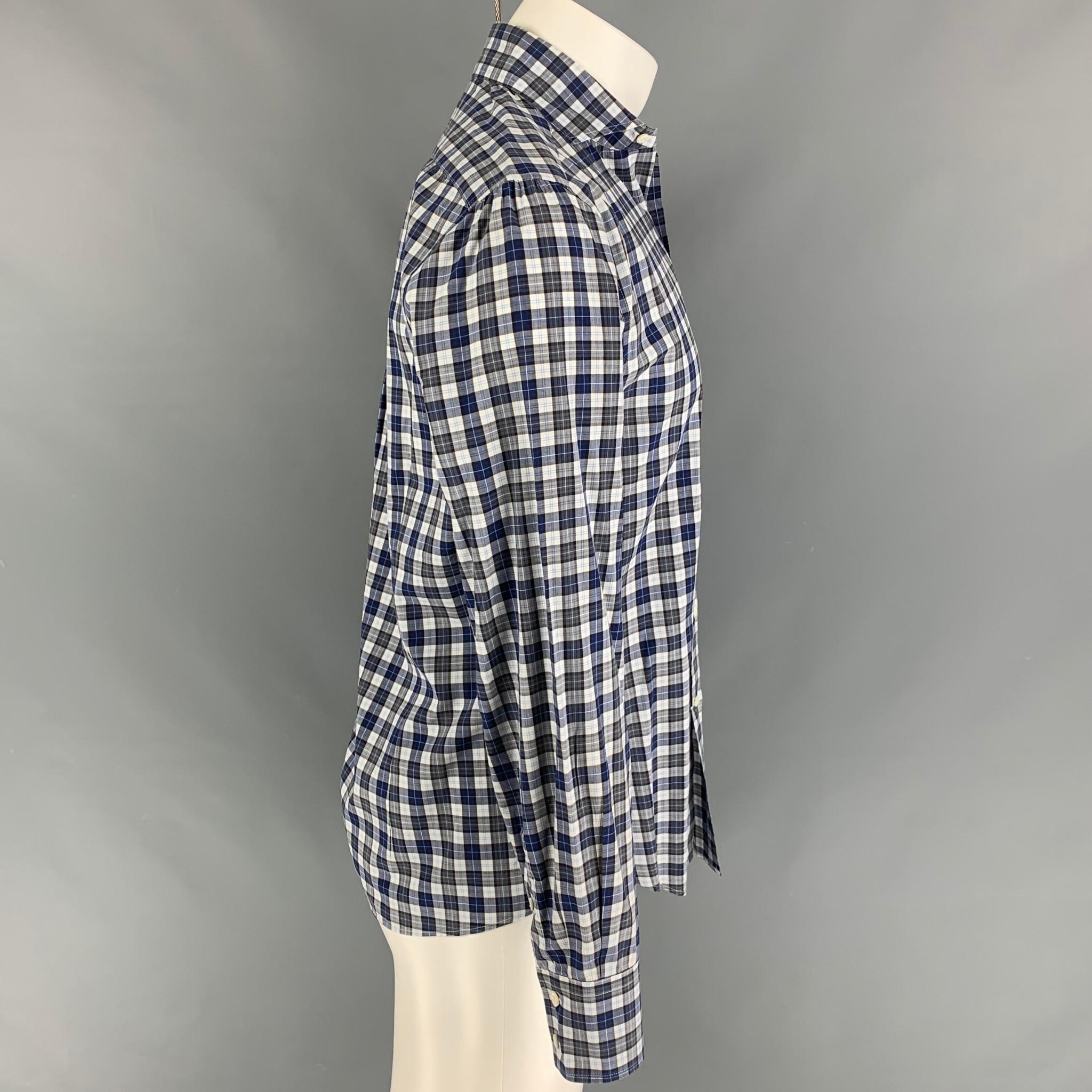 BRUNELLO CUCINELLI long sleeve shirt comes in a blue & white checkered cotton featuring a slim fit, spread collar, and a buttoned closure. 

Excellent Pre-Owned Condition.
Marked: M

Measurements:

Shoulder: 18 in.
Chest: 40 in.
Sleeve: 25