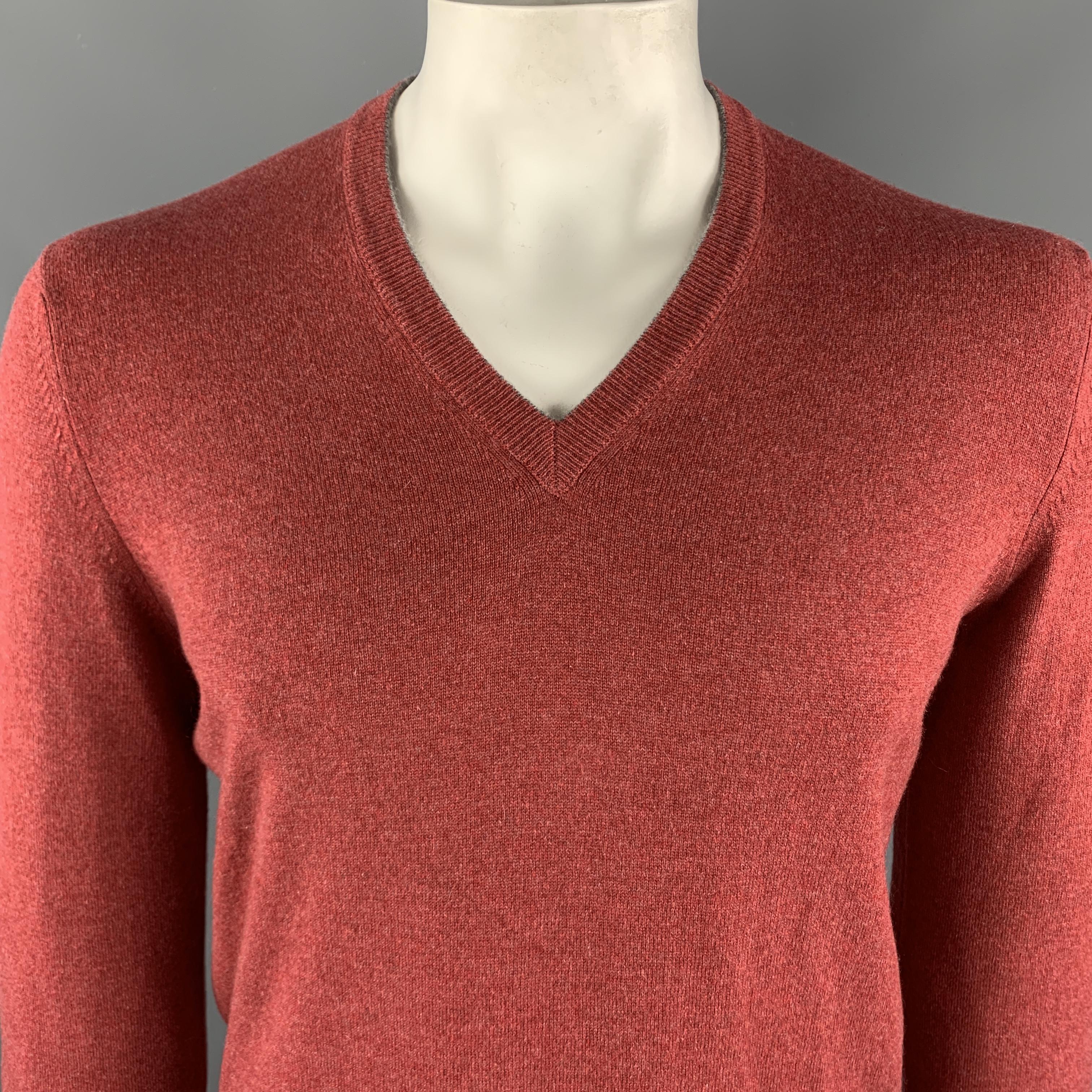 BRUNELLO CUCINELLI Pullover Sweater comes in a brick tone in a knitted wool cashmere material, with a V-neck, and ribbed cuffs and hem. Made in Italy.

Excellent Pre-Owned Condition.
Marked: IT 50

Measurements:

Shoulder: 18 in. 
Chest: 44 in.