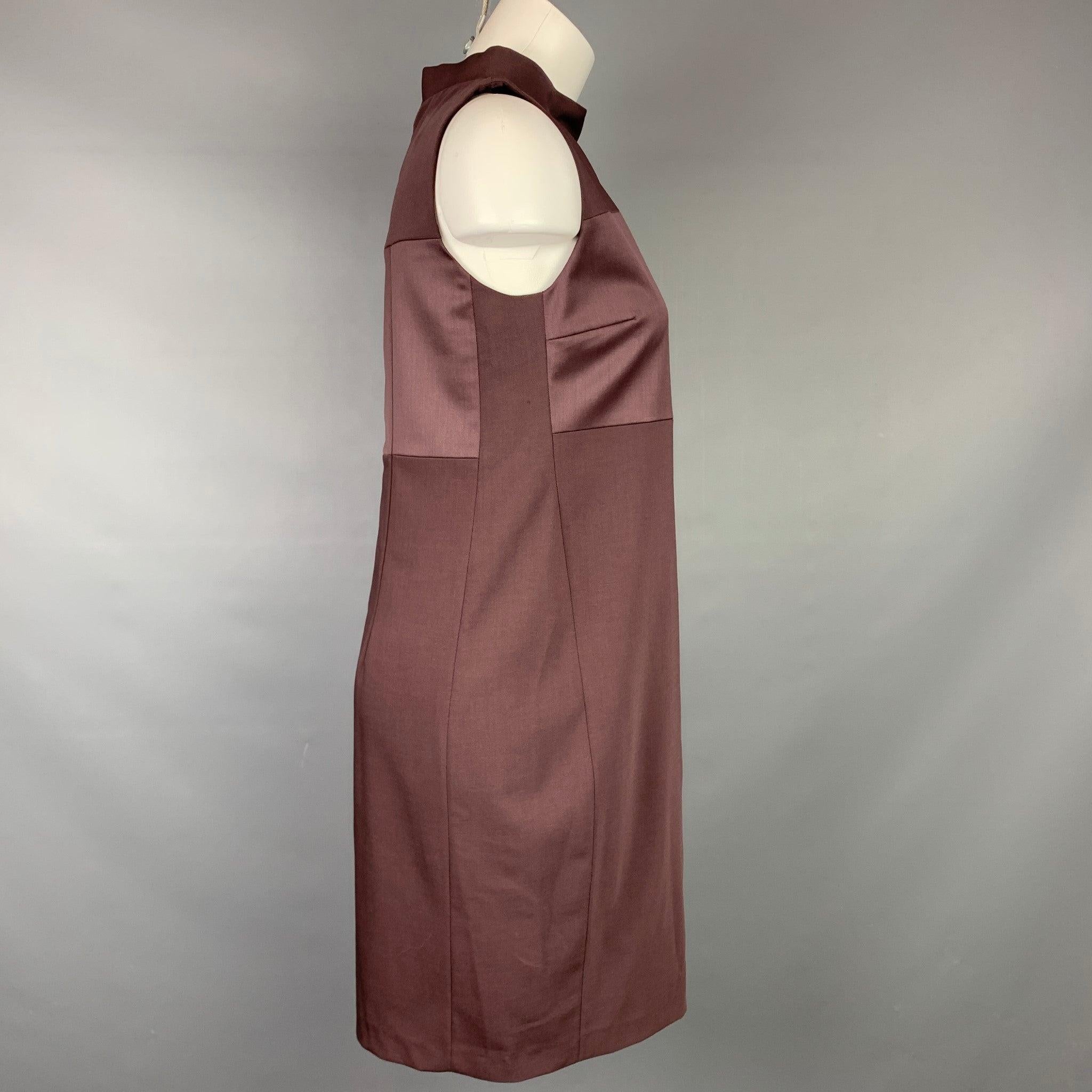 BRUNELLO CUCINELLI dress comes in a eggplant virgin wool with a slip liner featuring a mock turtleneck, a-line, top stitching, and a back zipper closure. Made in Italy.Very Good
Pre-Owned Condition. 

Marked:   M 

Measurements: 
  Bust: 33 inches 