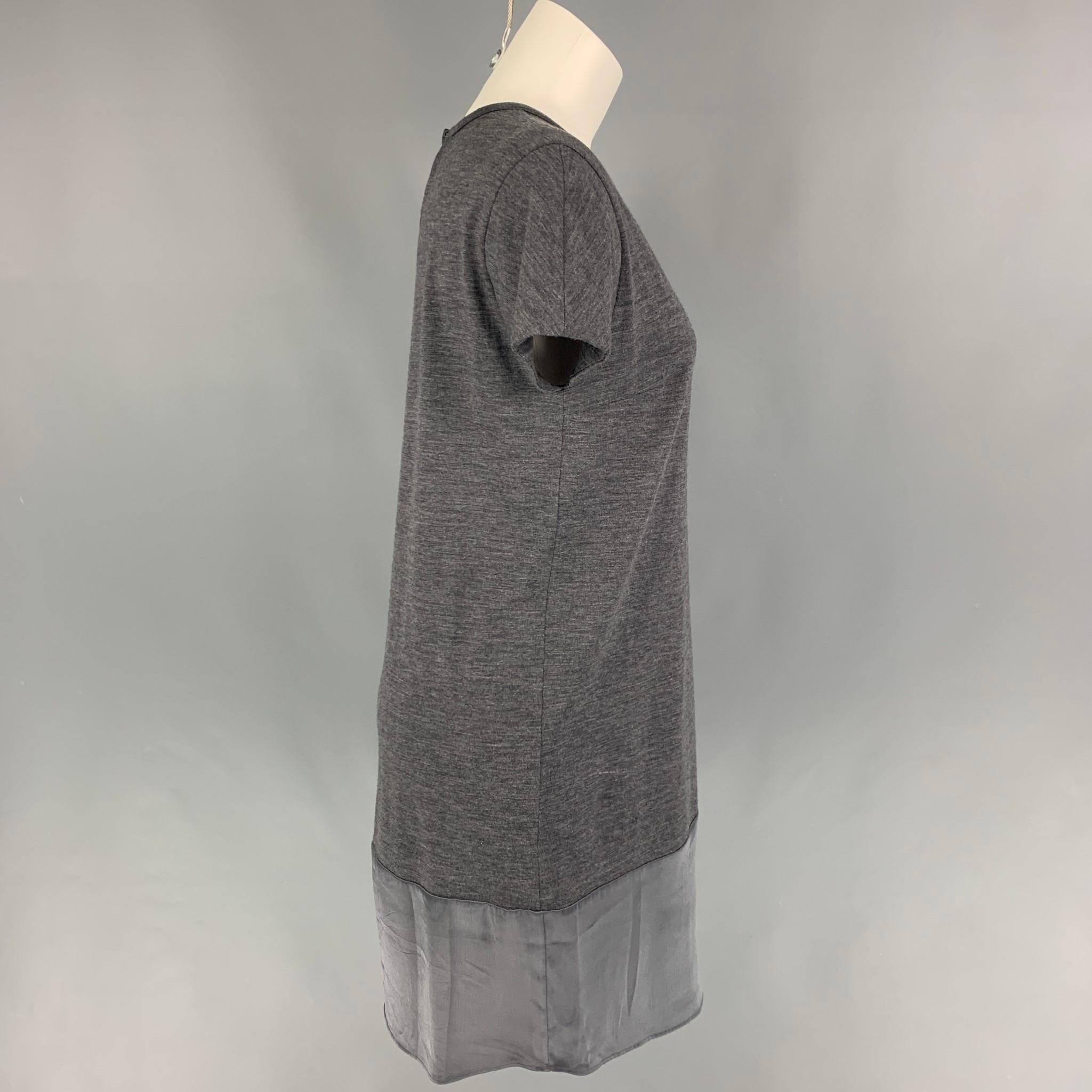 BRUNELLO CUCINELLI dress comes in a grey wool featuring a shift style, short sleeves, and a satin panel. Made in Italy. 

Very Good Pre-Owned Condition.
Marked: M

Measurements:

Shoulder: 16.5 in.
Bust: 38 in.
Hip: 38 in.
Sleeve: 6.5 in.
Length:
