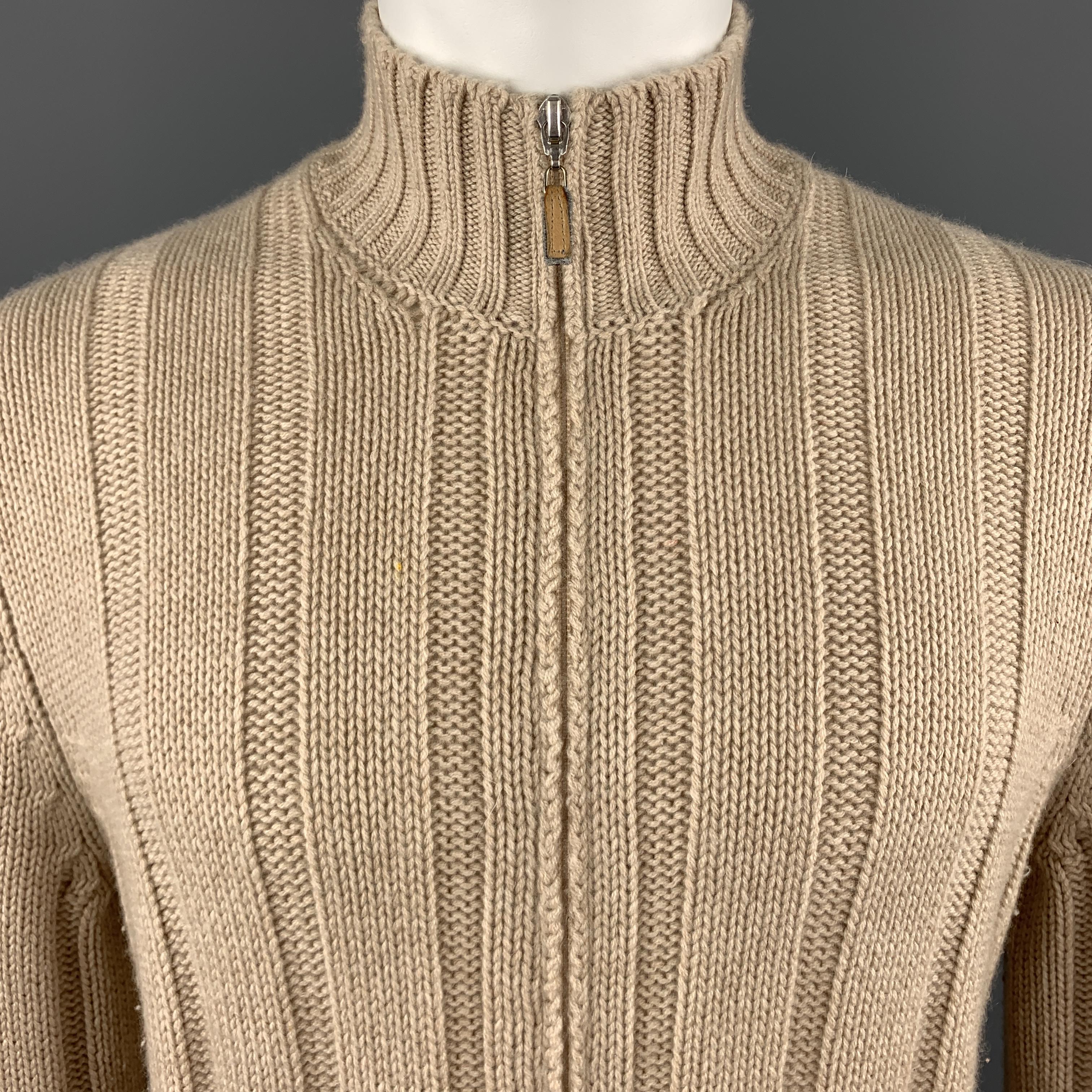 BRUNELLO CUCINELLI cardigan jacket comes in beige khaki cashmere thick ribbed knit with a high mock neck, double zip front, and slanted zip pockets. Made in Italy.

Very Good Pre-Owned Condition.
Marked: IT 50

Measurements:

Shoulder: 16 in.
Chest: