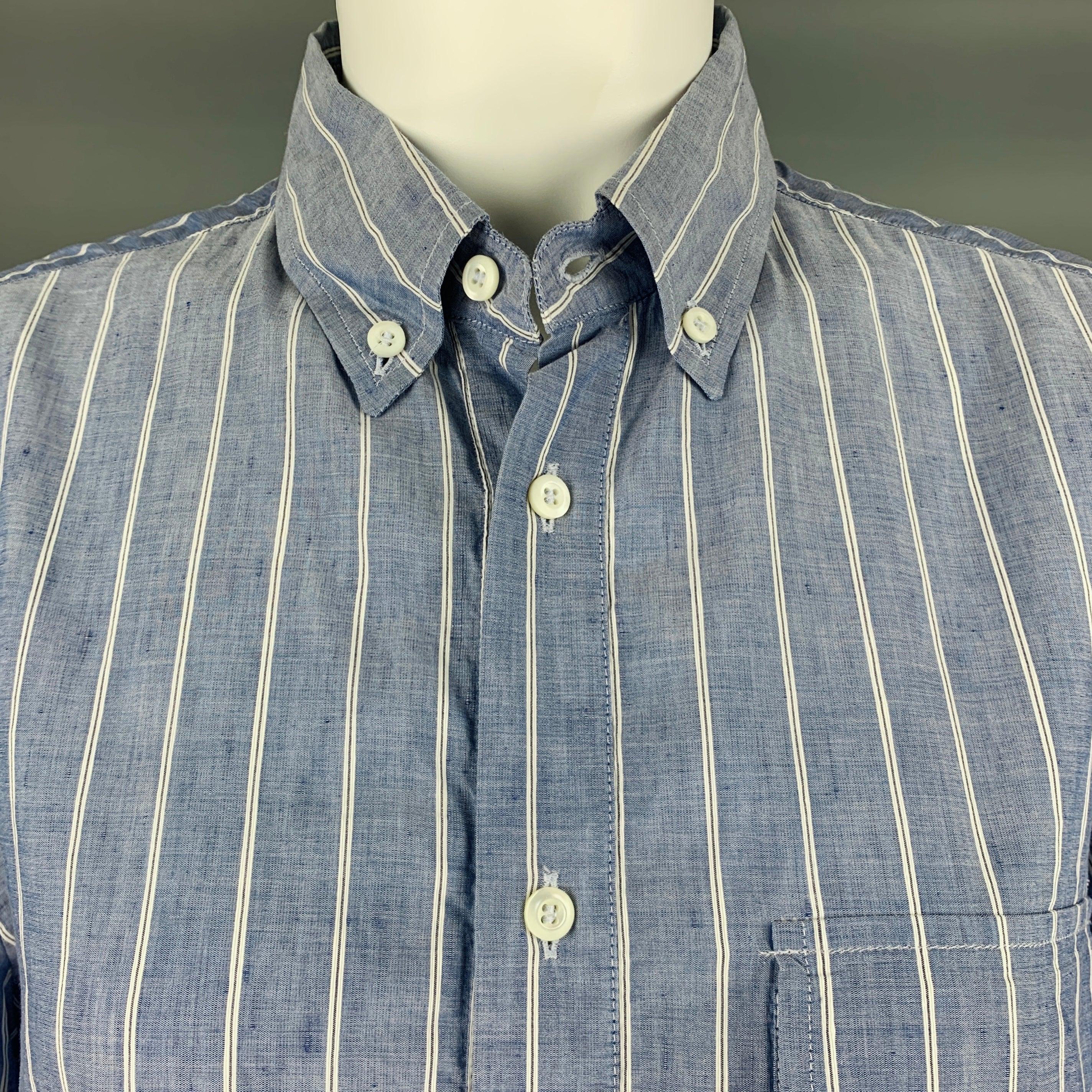 BRUNELLO CUCINELLI long sleeve shirt
in a
blue and white woven fabric featuring stripe pattern, button down collar, and long placket button closure. Made in Italy. Note: this item has been altered, please check measurements. Photos were taken on a