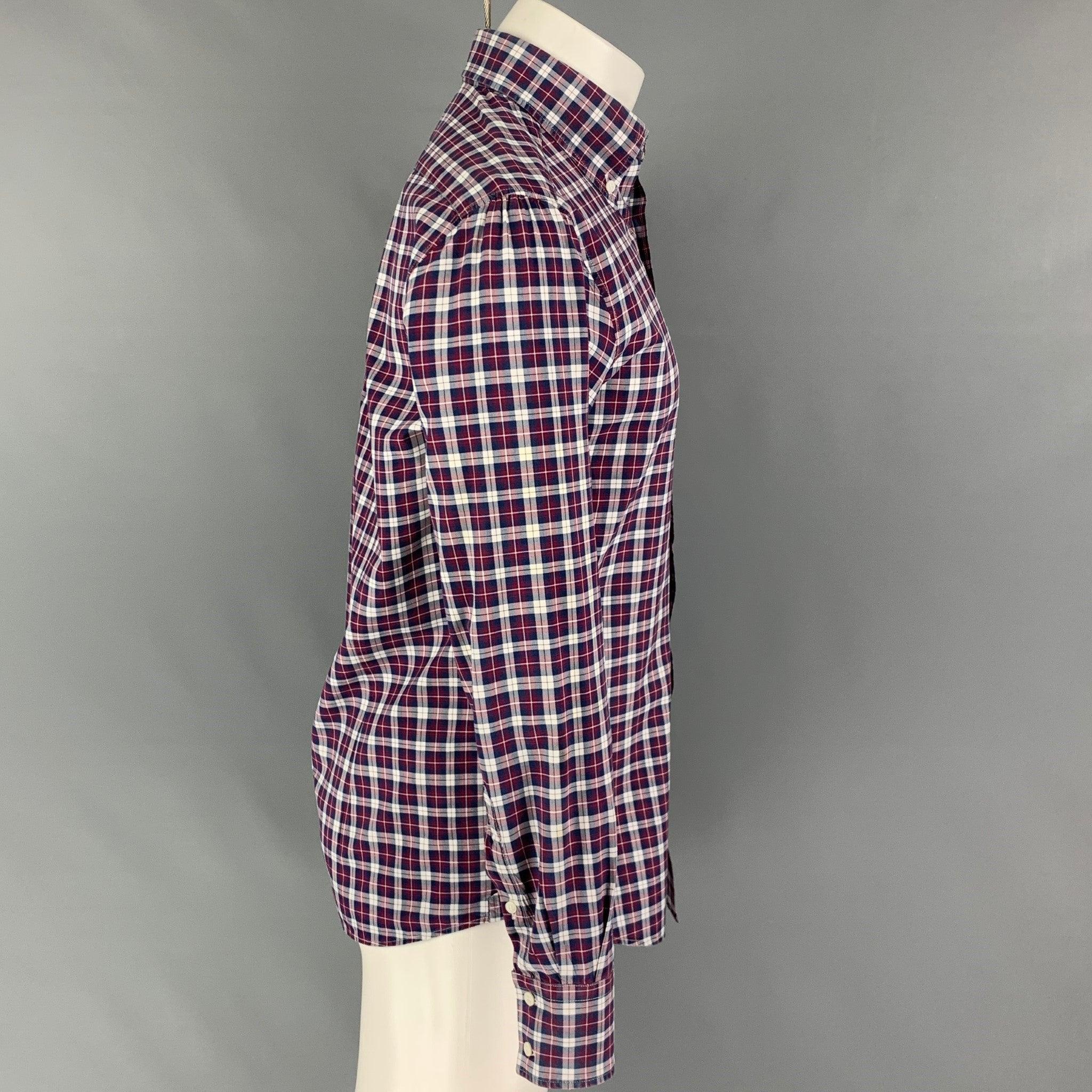 BRUNELLO CUCINELLI long sleeve shirt comes in a navy & burgundy plaid cotton featuring a slim fit, button down collar, and a button up closure. Made in Italy.
Very Good Pre-Owned Condition. Item has been altered at both shoulder seam. Please see