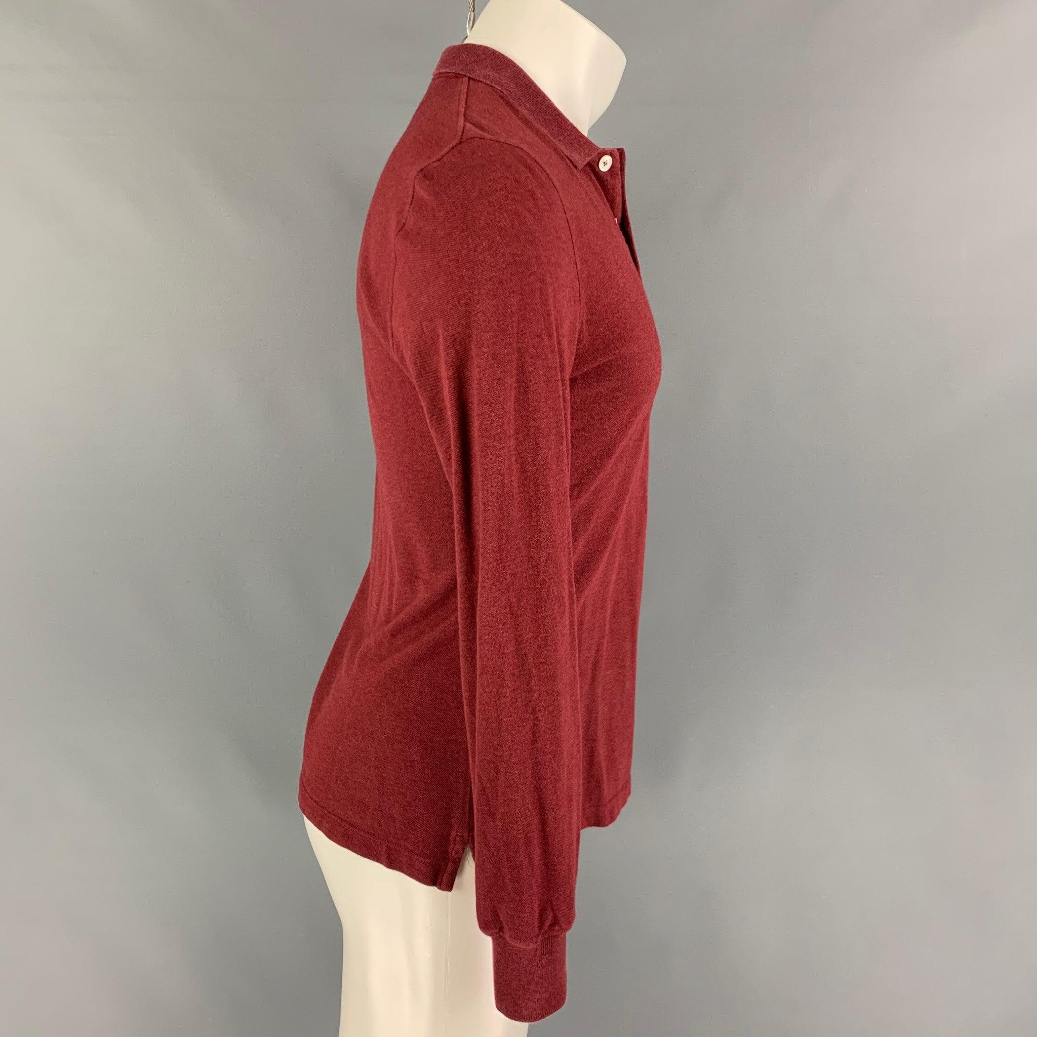 BRUNELLO CUCINELLI polo comes in a red cotton featuring a spread collar and a double button closure. Made in Italy.
Good
Pre-Owned Condition. Light wear. As-is.  

Marked:   S 

Measurements: 
 
Shoulder: 16 inches  Chest: 38 inches  Sleeve: 27