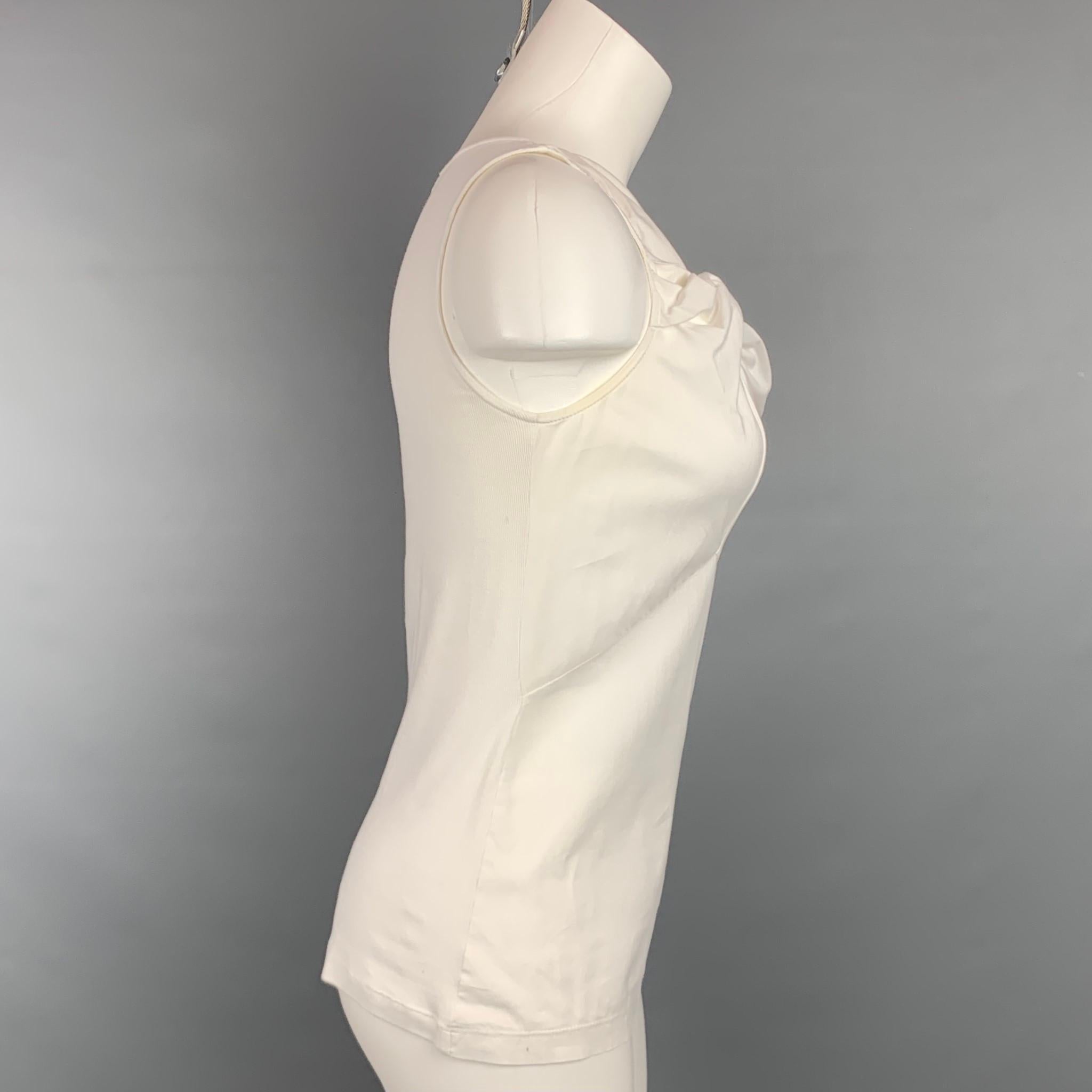 BRUNELLO CUCINELLI blouse comes in a white cotton / lycra featuring a sleeveless style and a knotted detail. Made in Italy.

Very Good Pre-Owned Condition.
Marked: S

Measurements:

Bust: 32 in.
Length: 21 in.