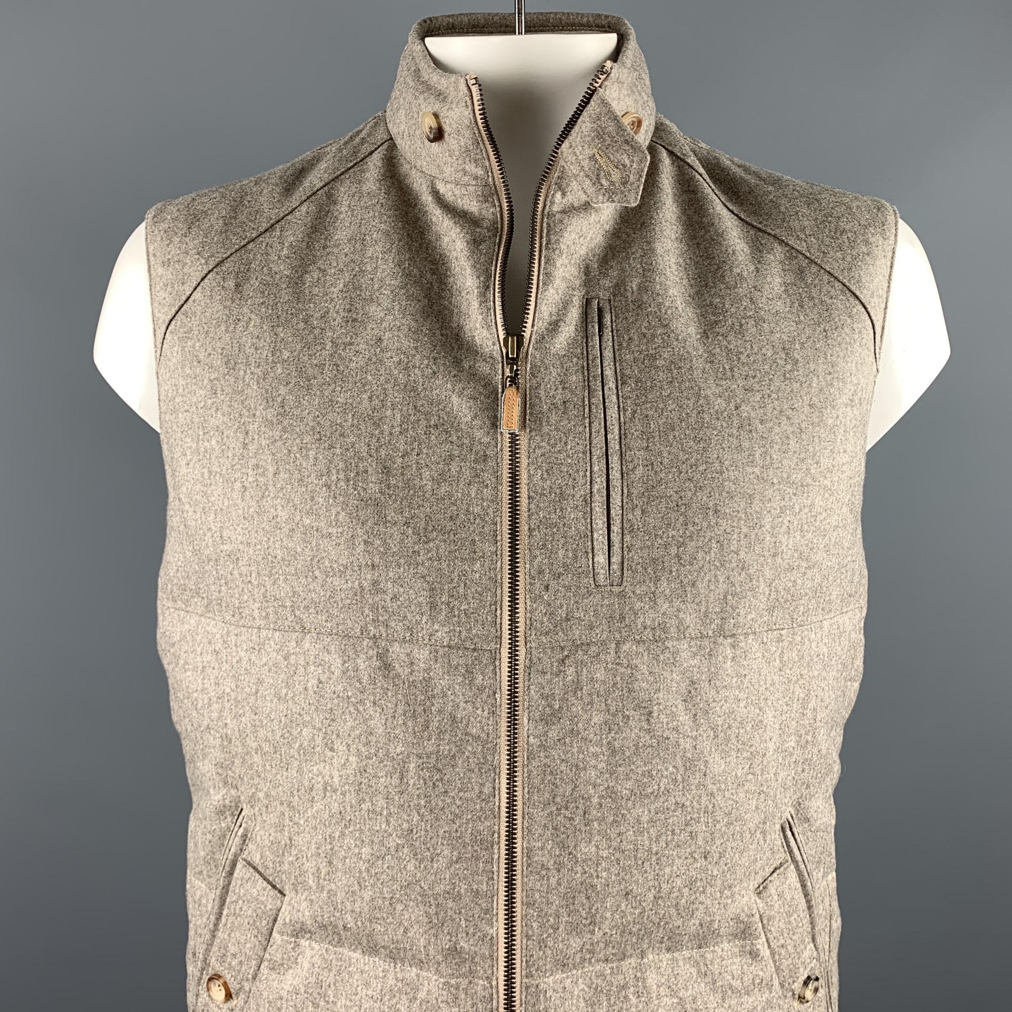BRUNELLO CUCINELLI vest comes in a oatmeal quilted wool / cashmere featuring a buttoned collar, inner pockets, front zipper pockets, stitching details, and a zip up closure. Made in Italy.

New With Tags.
Marked: XL

Measurements:

Shoulder: 19