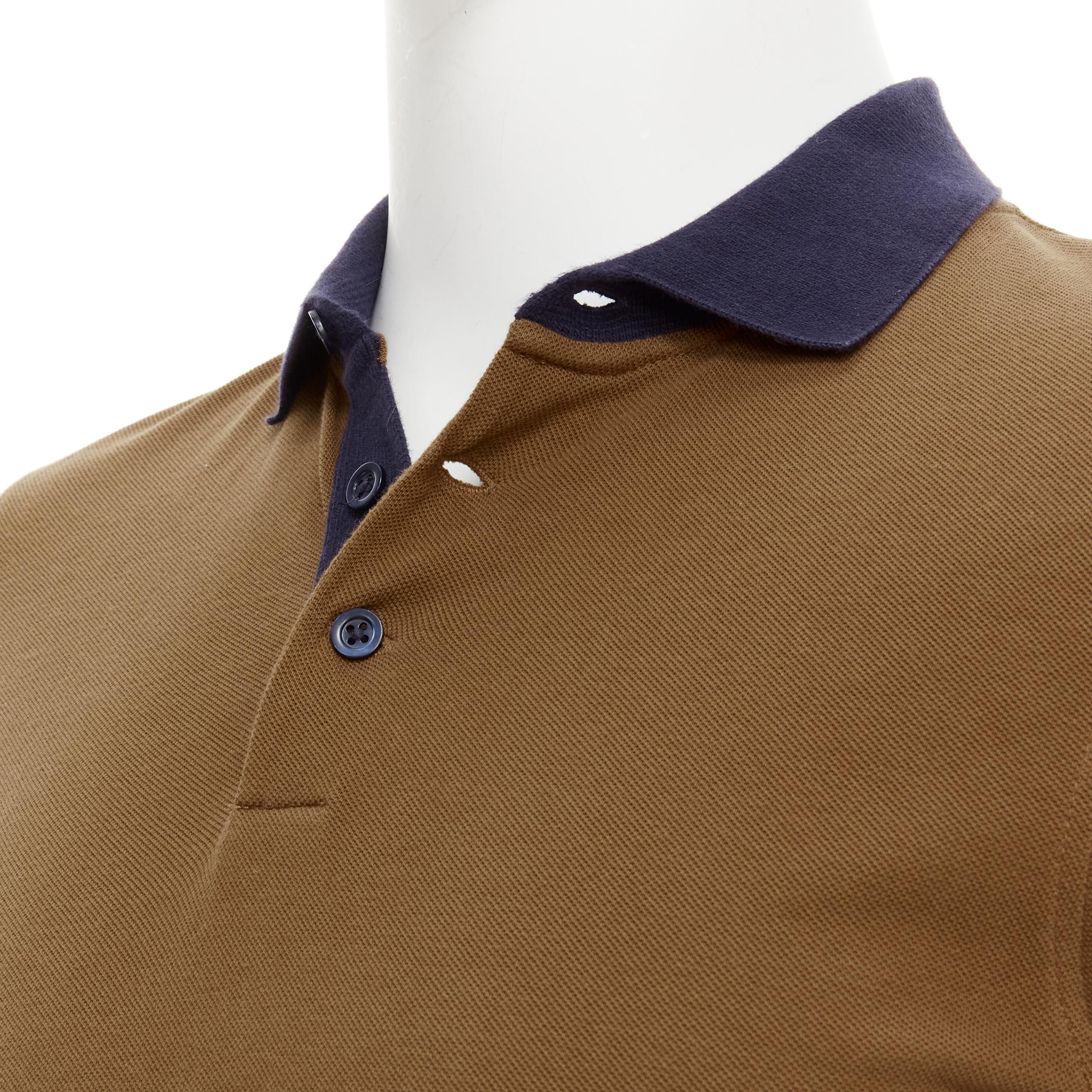 BRUNELLO CUCINELLI Slim Fit brown navy polo shirt XS 
Reference: CRTI/A00723 
Brand: Brunello Cucinelli 
Material: Cotton 
Color: Brown 
Pattern: Solid 
Closure: Button 
Made in: Italy 

CONDITION: 
Condition: Good, this item was pre-owned and is in
