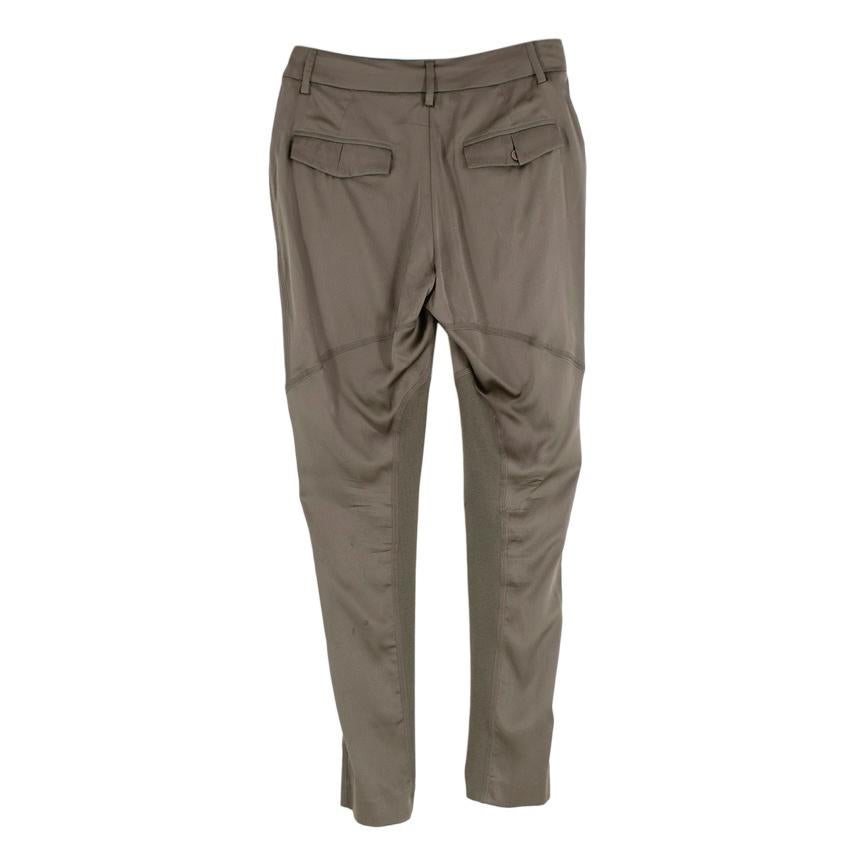 Brunello Cucinelli Steel Grey Silk & Jersey Panelled Trousers 
 

 - Steel grey silk jodphur style trousers with jersey inside leg panel 
 -Concealed zip, hook, and bar fastening as well as a drawstring waistband
 -Side insert pockets and rear