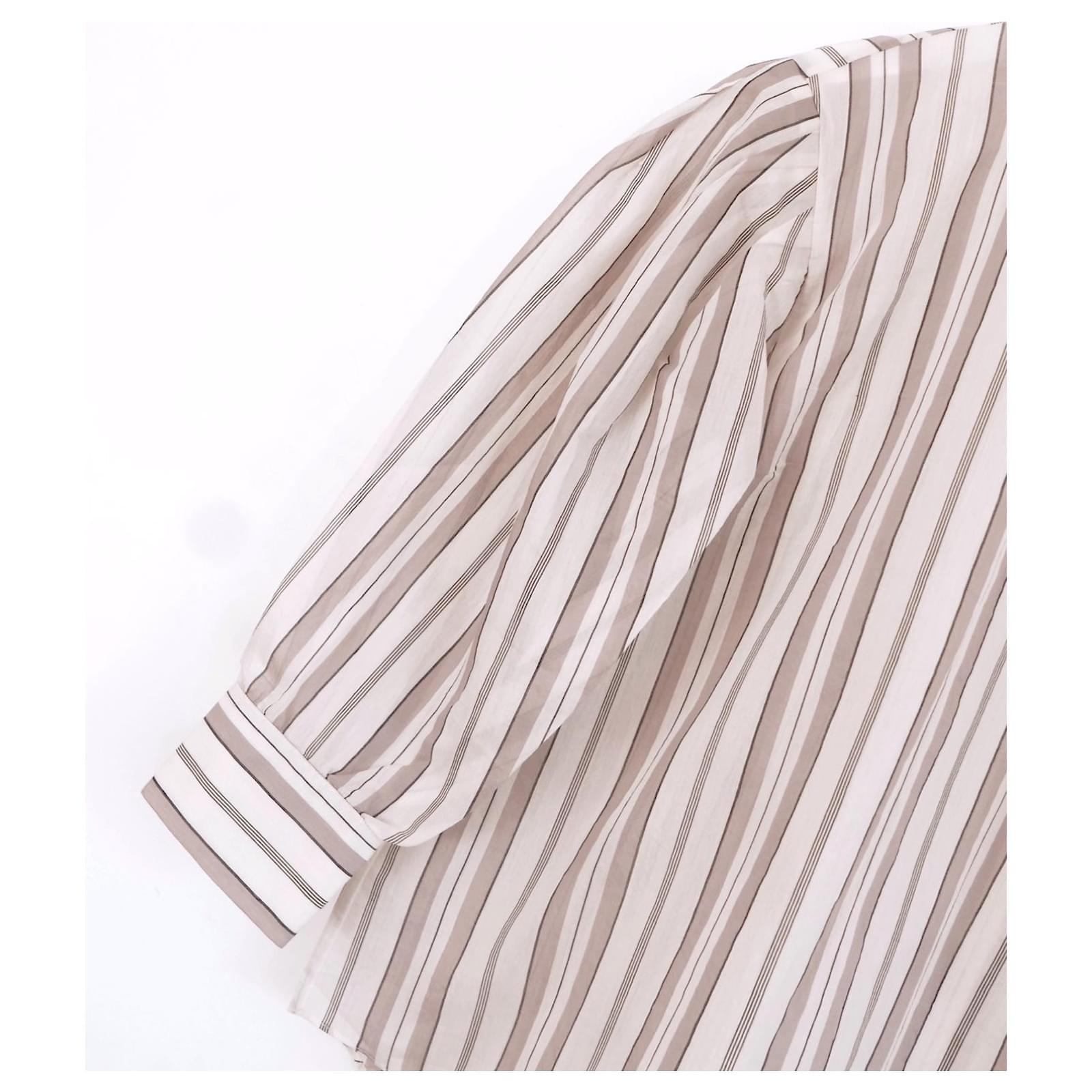 Ultra luxe Brunello Cucinelli striped puffed sleeve blouse. bought for £1500 and new with tag. Made from beige, brown and cream striped cotton and silk voile with super delicate signature bead embellishment to the back of the neck. It has a loose