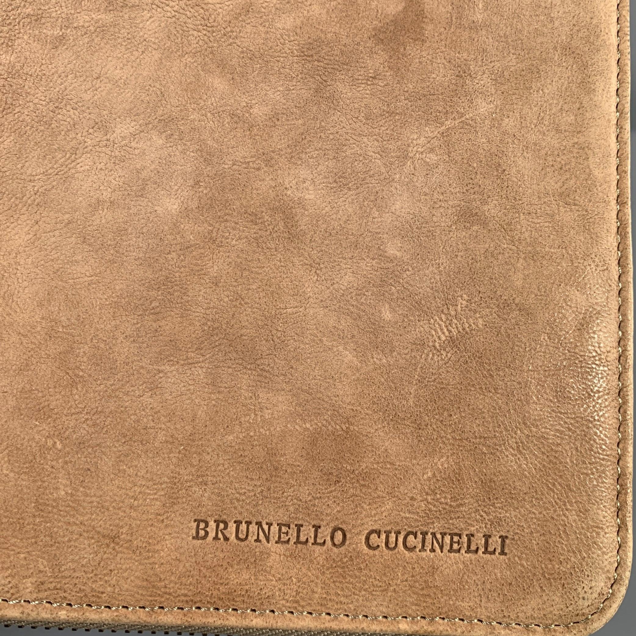 BRUNELLO CUCINELLI iPad case comes in a taupe leather with a taupe interior featuring an extra protective, insert slots, and a zipper closure. Fits a regular iPad. Very Good Pre-Owned Condition. Signs of wear. 

Measurements: 
  Leng 8.5 inches