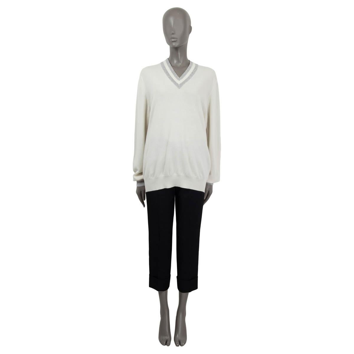 100% authentic Brunello Cucinelli long sweater in ivory and gray cashmere (100%). Features long sleeves, a striped v-neck and striped cuffs. Unlined. Has been worn and is in excellent condition.

Measurements
Tag Size	L
Size	L
Shoulder Width	48cm