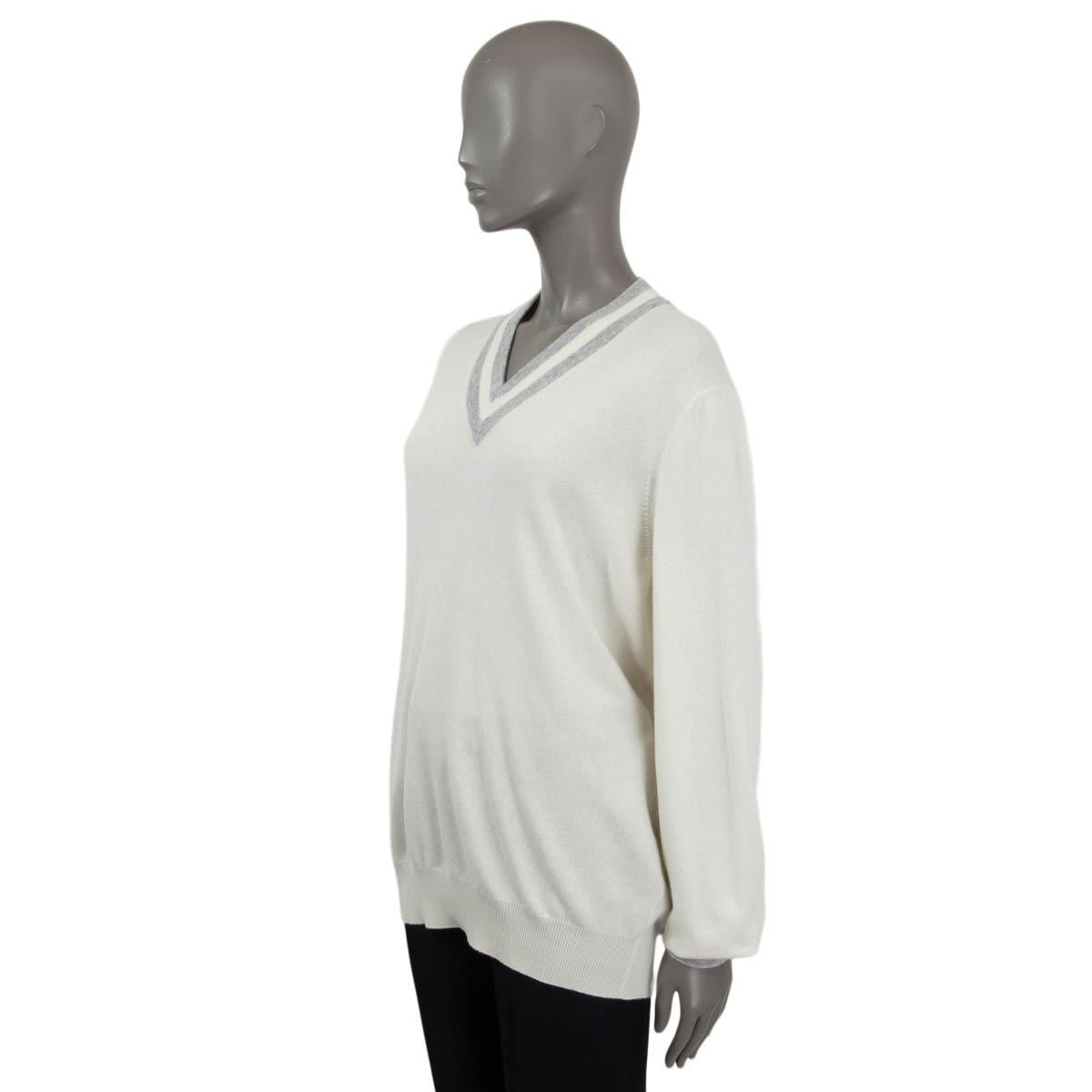 white v neck sweater with black trim
