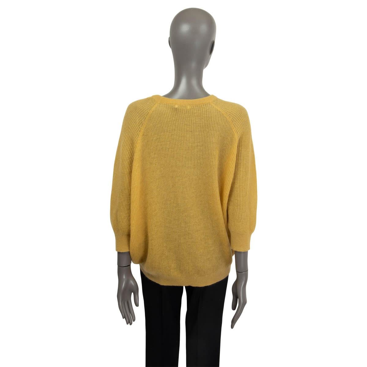 philosophy yellow sweater