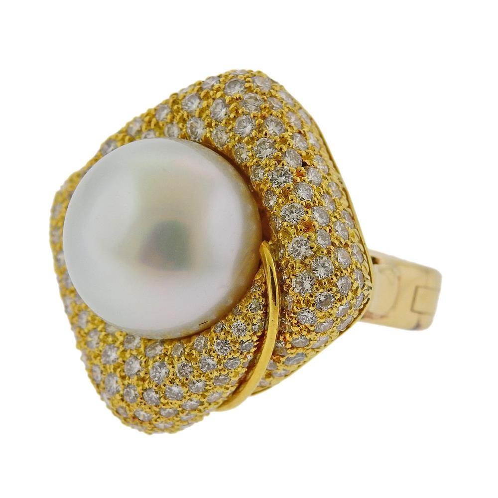 14k yellow gold ring by Bruner. Set with South Sea Pearl - 13.7mm, and approx. 2.00ctw in diamonds. Ring is a size  4 3/4, ring top is 26mm at widest point. Marked Bruner 14k. Weight 22.3 grams.