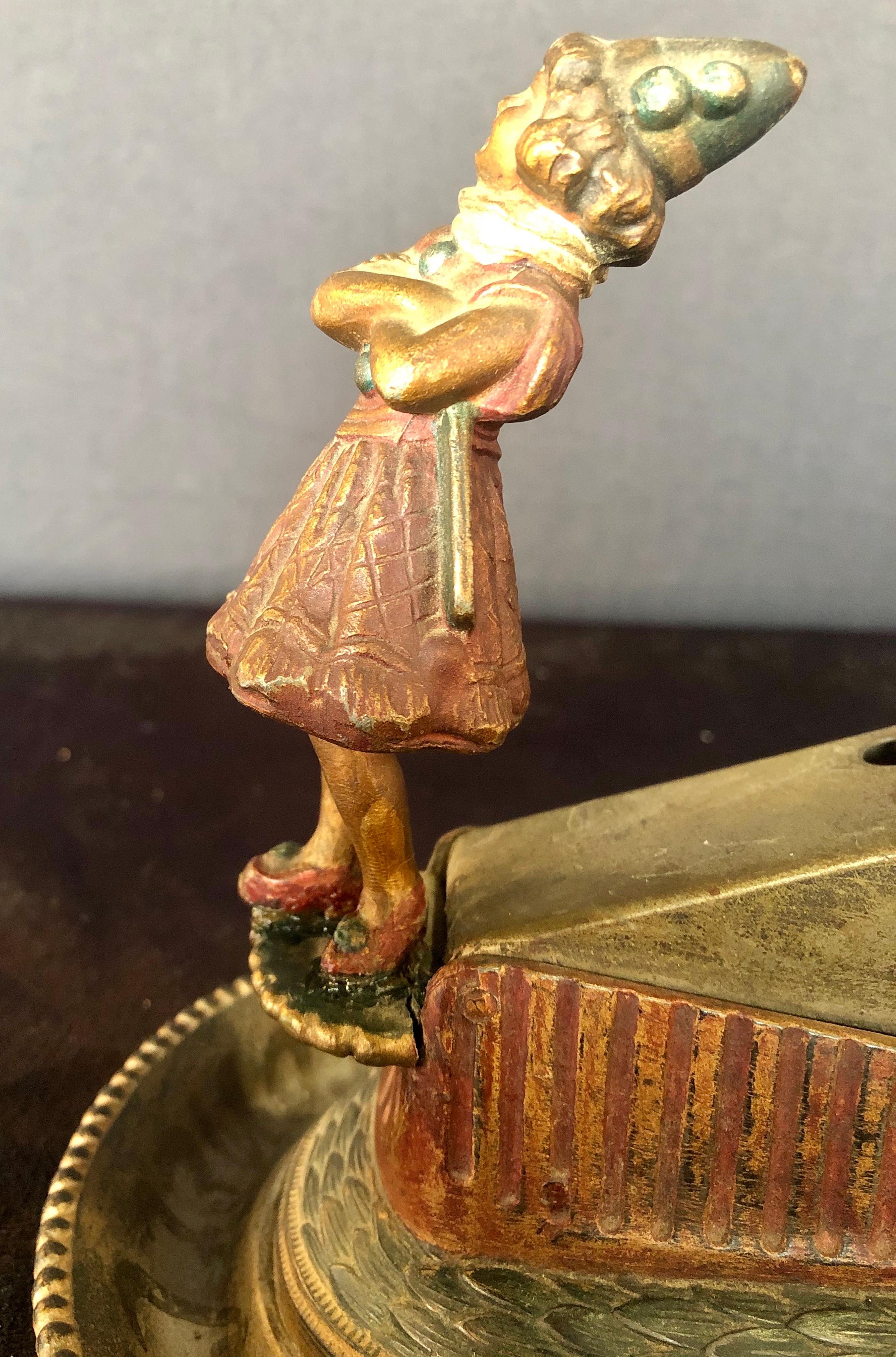 Brunhoff Mfg. Co. Antique Cigar Cutter with Leaning Lady Tobacco Accessory In Good Condition In Manhasset, NY