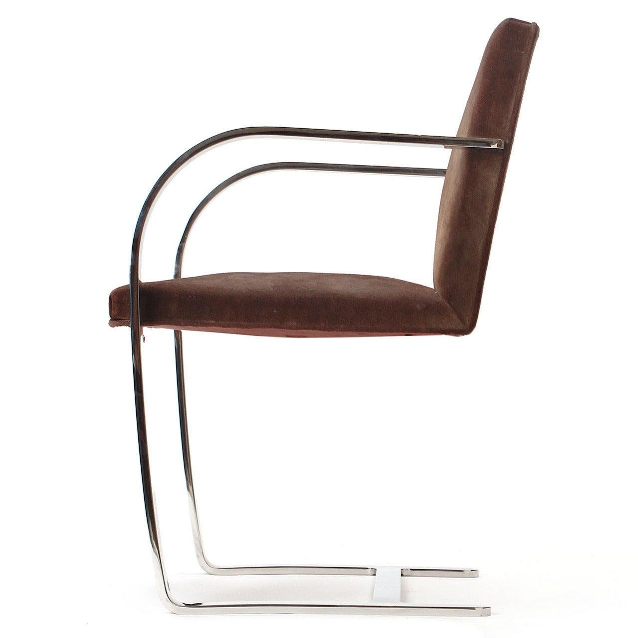 A 'Bruno' arm chair with metal frame and cantilevered seat and back retaining the original upholstery.